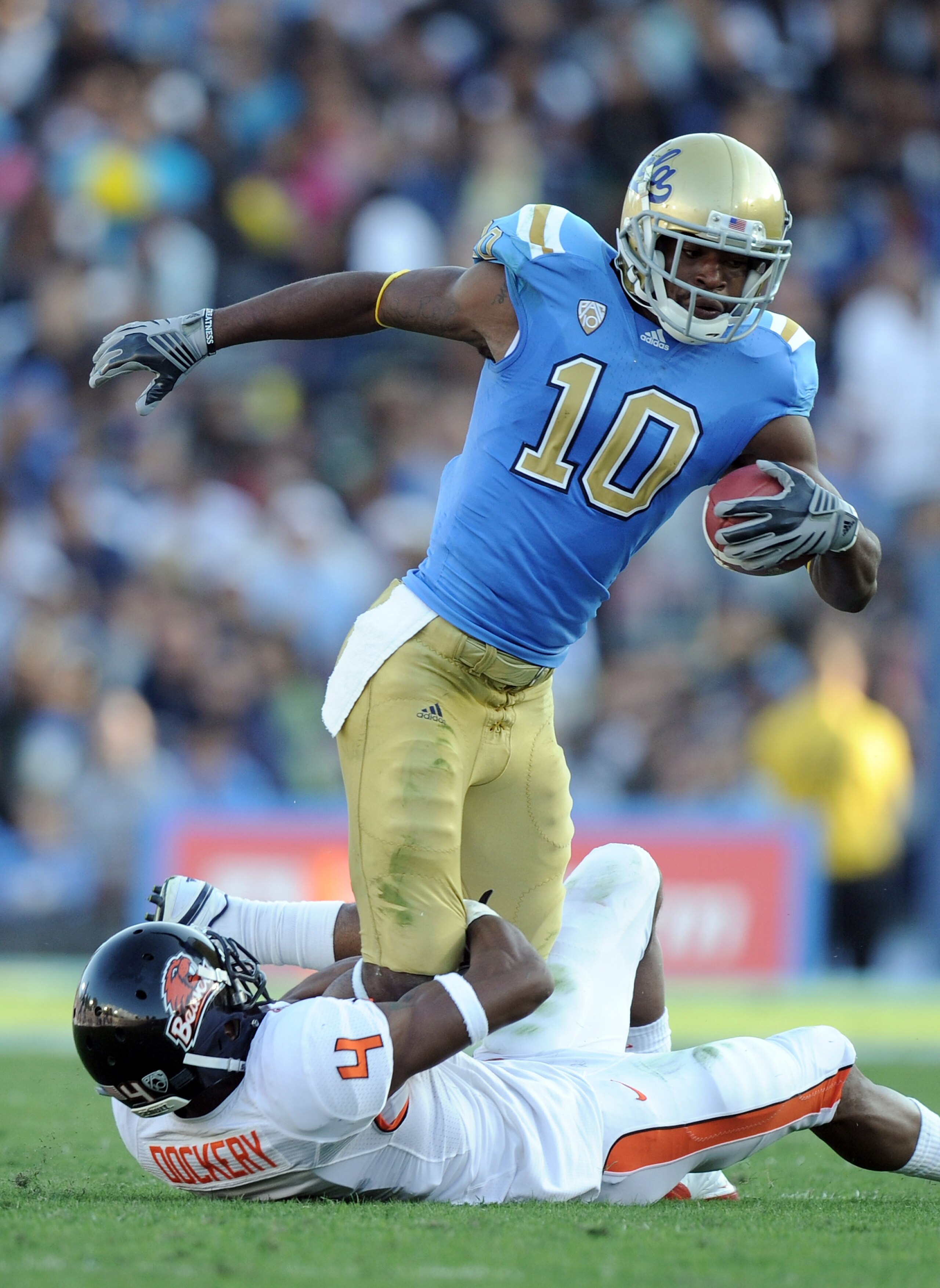 PASADENA, CA - NOVEMBER 06: Akeem Ayers #10 of the UCLA Bruins is tackled by James Dockery #4 of the Oregon State Beavers during the first quarter at the Rose Bowl on November 6, 2010 in Pasadena, California. (Photo by Harry How/Getty Images) PASADENA, CA - NOVEMBER 06: Akeem Ayers #10 of the UCLA Bruins is tackled by James Dockery #4 of the Oregon State Beavers during the first quarter at the Rose Bowl on November 6, 2010 in Pasadena, California. (Photo by Harry How/Getty Images)