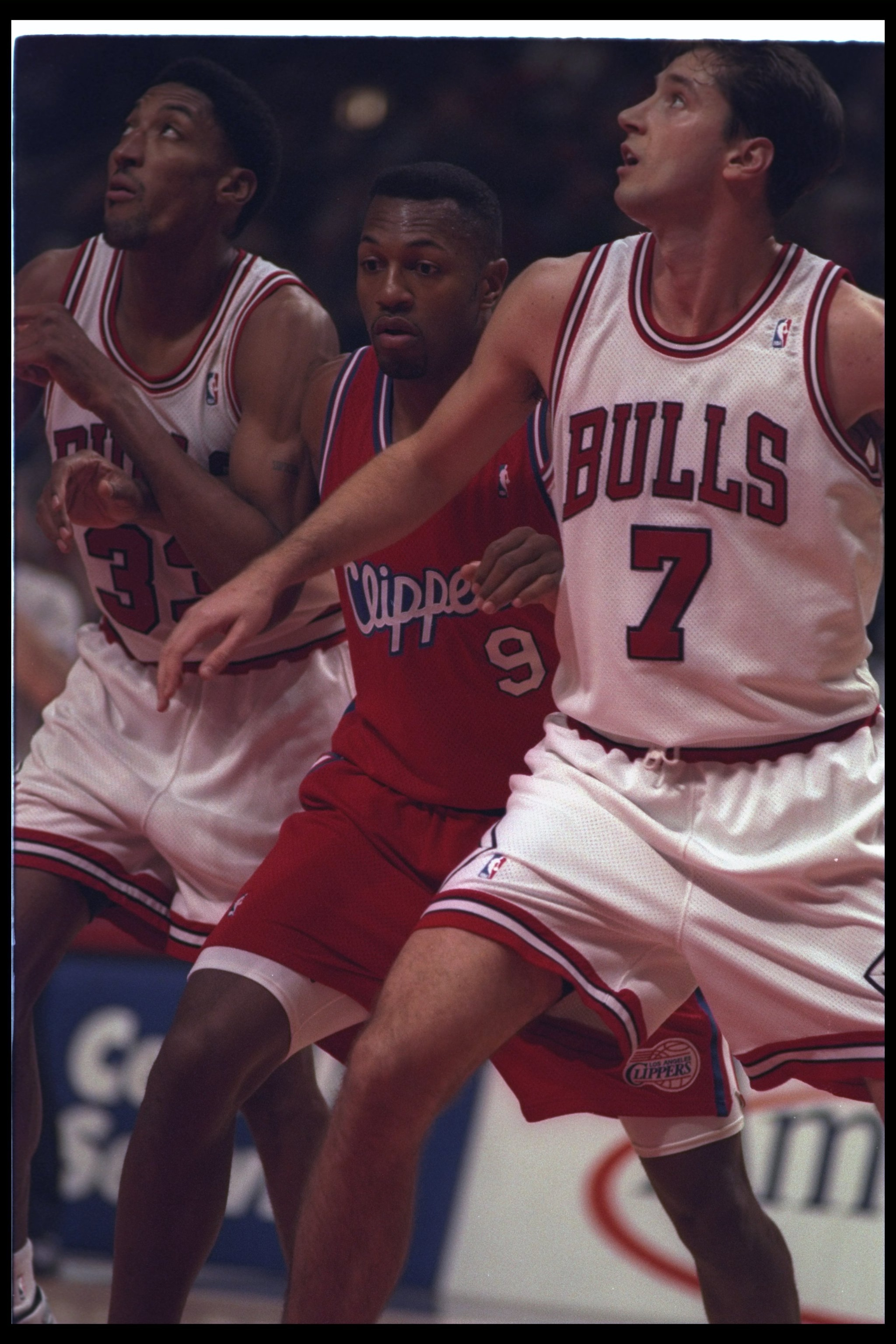 27 Dec 1994: Forward Tony Massenburg of the Los Angeles Clippers gets caught between Chicago Bulls forwards Toni Kukoc (right) and Scottie Pippen during a game at the United Center in Chicago, Illinois. The Clippers won the game, 95-92.