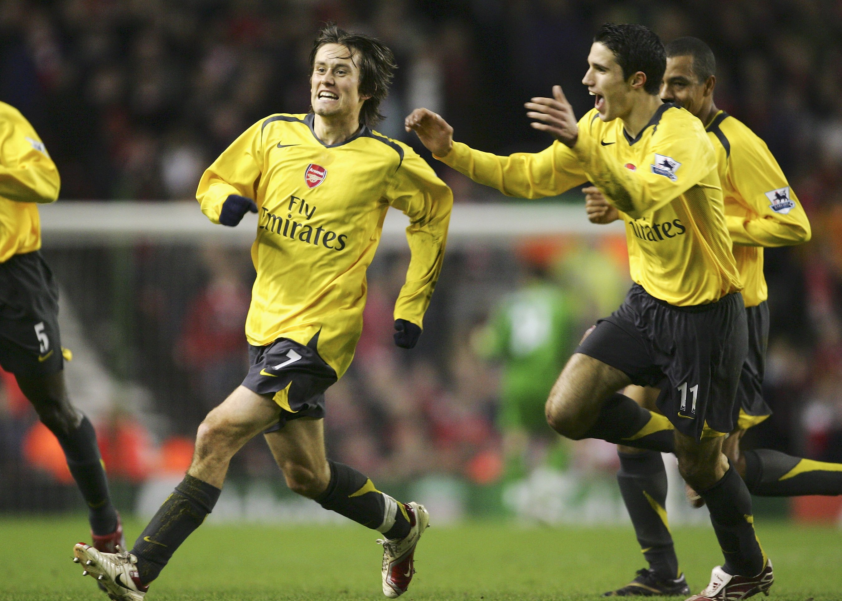 LIVERPOOL, UNITED KINGDOM - JANUARY 06: Tomas Rosicky of Arsenal celebrates scoring the opening goal with team mate Robin Van Persie (R) during the FA Cup sponsored by E.ON Third Round match between Liverpool and Arsenal at Anfield on January 6, 2007 in L
