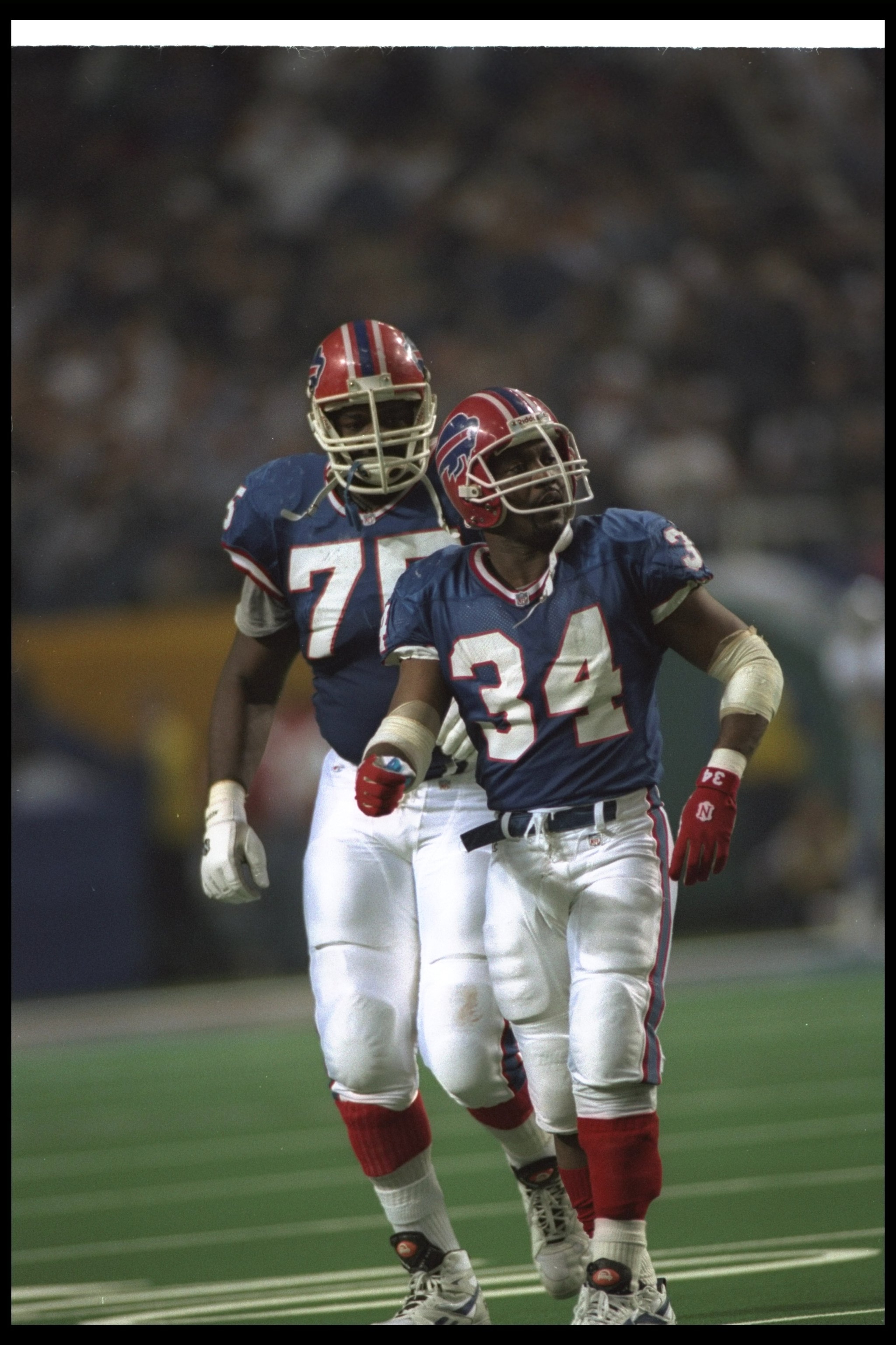 30 Jan 1994:  Running back Thurman Thomas #34 of the Buffalo Bills walks off the field after fumbling the football during Super Bowl XXVIII against the Dallas Cowboys at the Georgia Dome in Atlanta, Georgia.  The Cowboys won the game, 30-13. Mandatory Cre