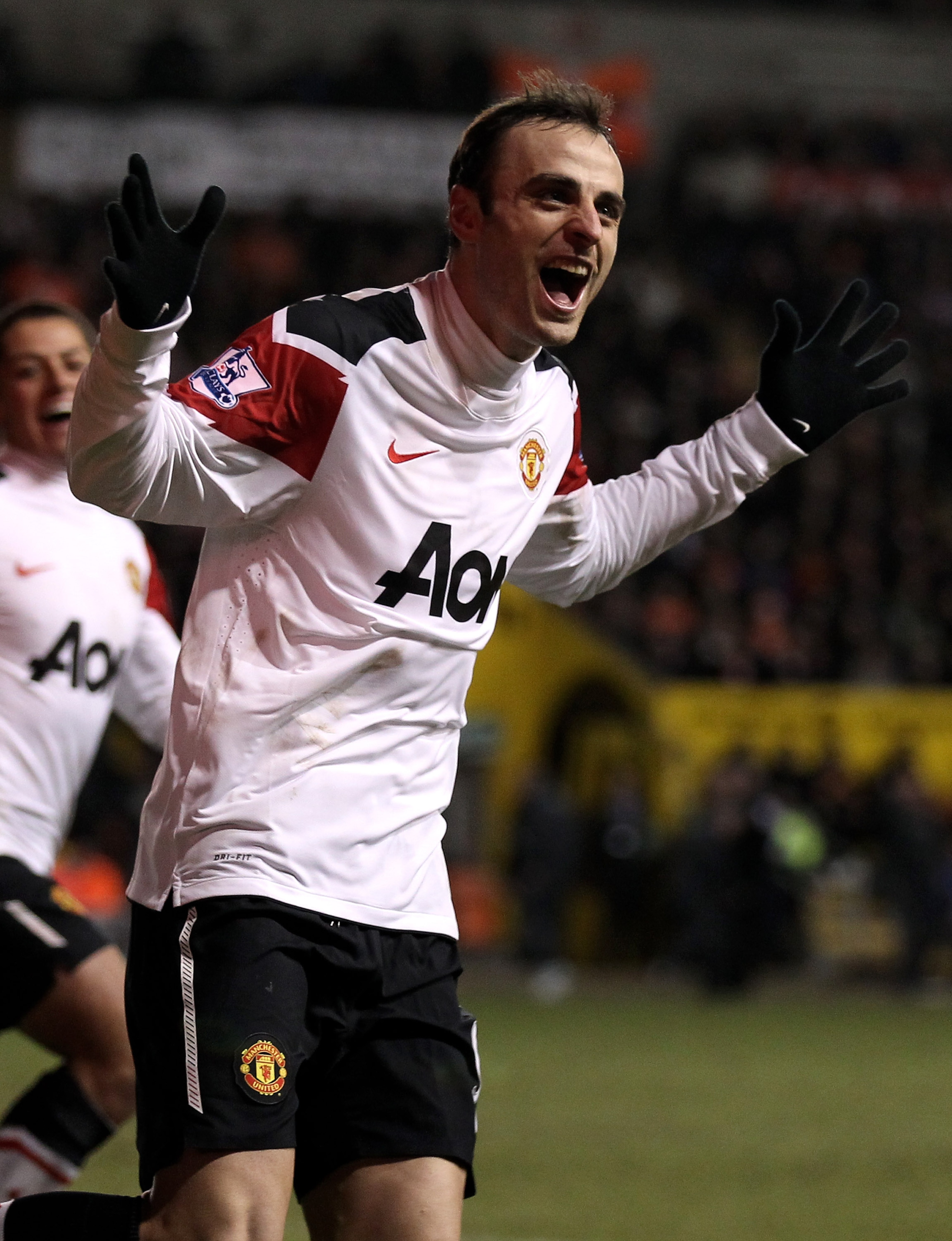 BLACKPOOL, ENGLAND - JANUARY 25: Dimitar Berbatov of Manchester United celebrates scoring his team's third goal during the Barclays Premier League match between Blackpool and Manchester United at Bloomfield Road on January 25, 2011 in Blackpool, England. BLACKPOOL, ENGLAND - JANUARY 25: Dimitar Berbatov of Manchester United celebrates scoring his team's third goal during the Barclays Premier League match between Blackpool and Manchester United at Bloomfield Road on January 25, 2011 in Blackpool, England.