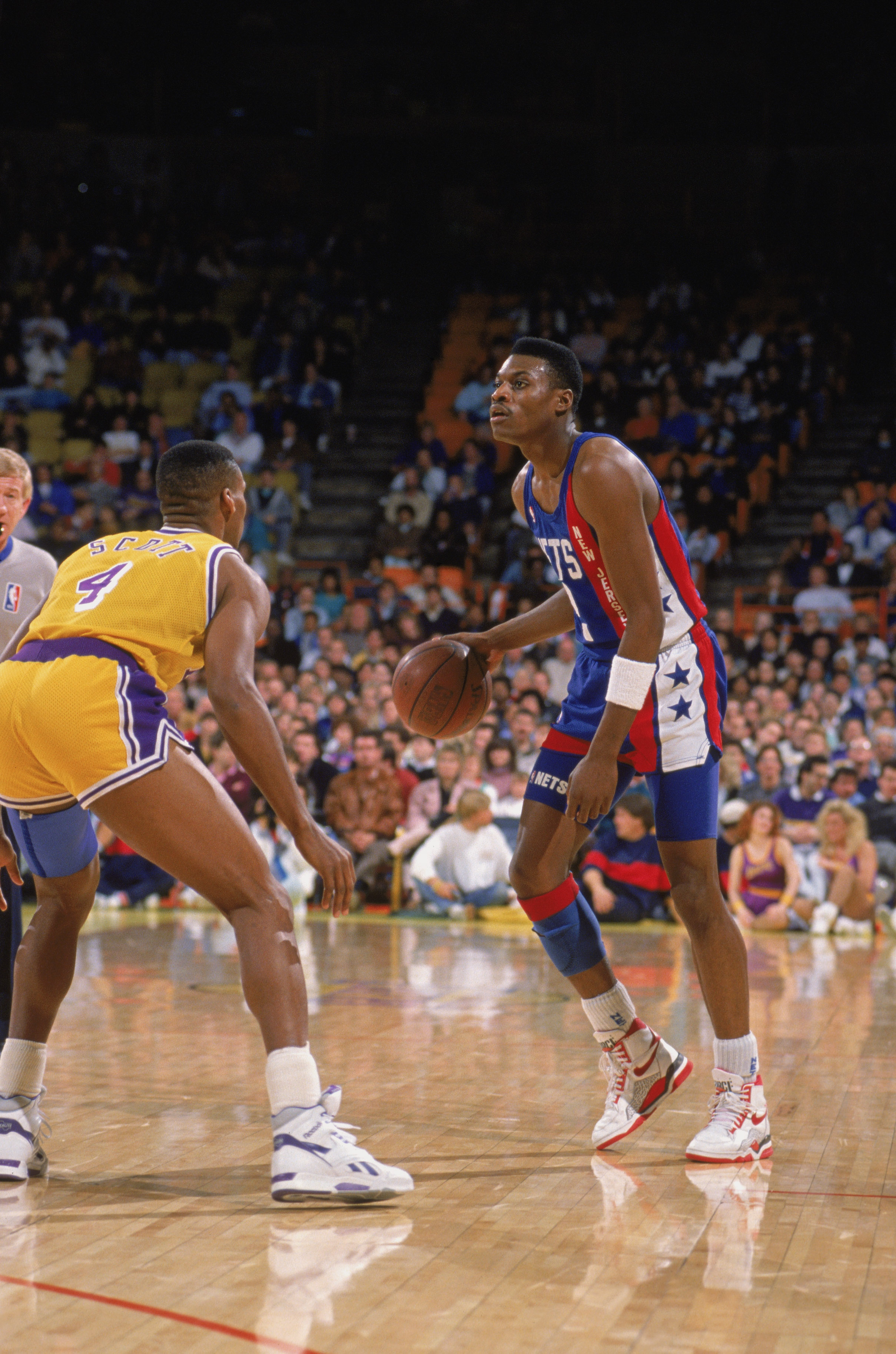 Mookie Blaylock of the New Jersey Nets dribbles up court during a