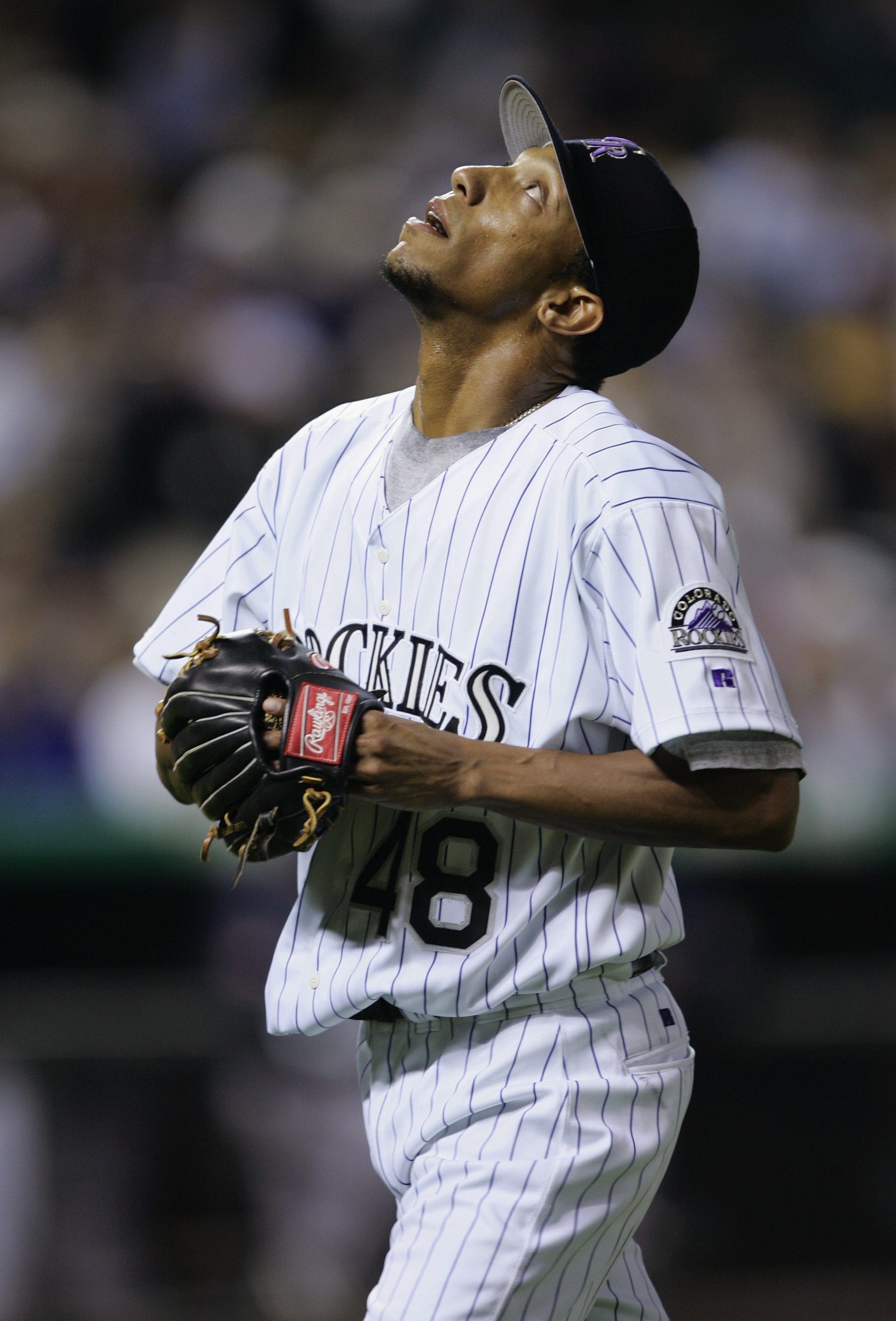 DENVER - JUNE 29: Marc Kroon #48 of the Colorado Rockies looks up as he heads back to the dugout after getting out of an inning against the Milwaukee Brewers on June 29, 2004 at Coors Field in Denver, Colorado. The Brewers held on to win 6-3. (Photo by DENVER - JUNE 29: Marc Kroon #48 of the Colorado Rockies looks up as he heads back to the dugout after getting out of an inning against the Milwaukee Brewers on June 29, 2004 at Coors Field in Denver, Colorado. The Brewers held on to win 6-3. (Photo by