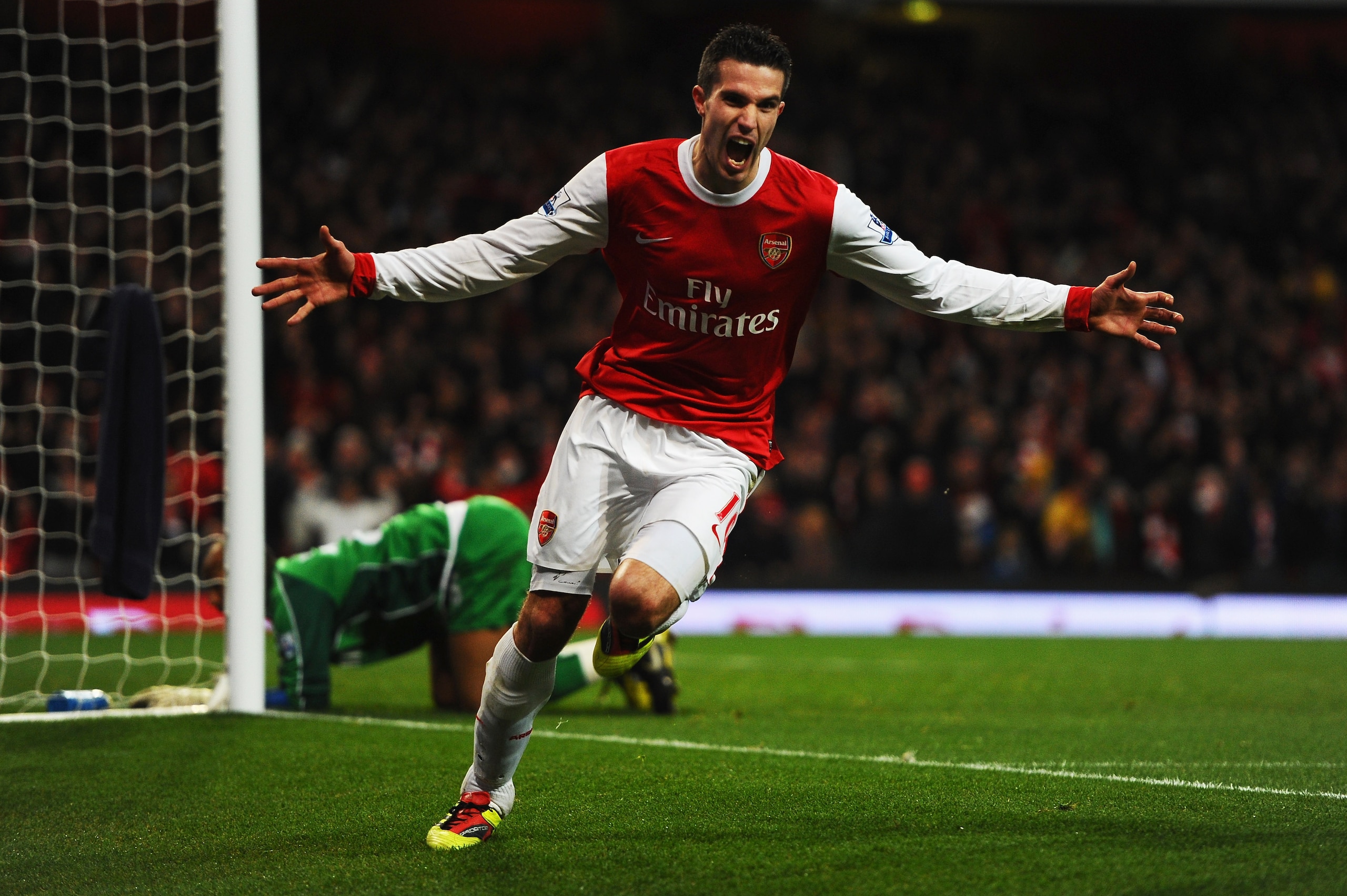 LONDON, UNITED KINGDOM - JANUARY 22:  Robin Van Persie of Arsenal celebrates scoring his third goal in a hat trick during the Barclays Premier League match between Arsenal and Wigan Athletic at the Emirates Stadium on January 22, 2011 in London, England.