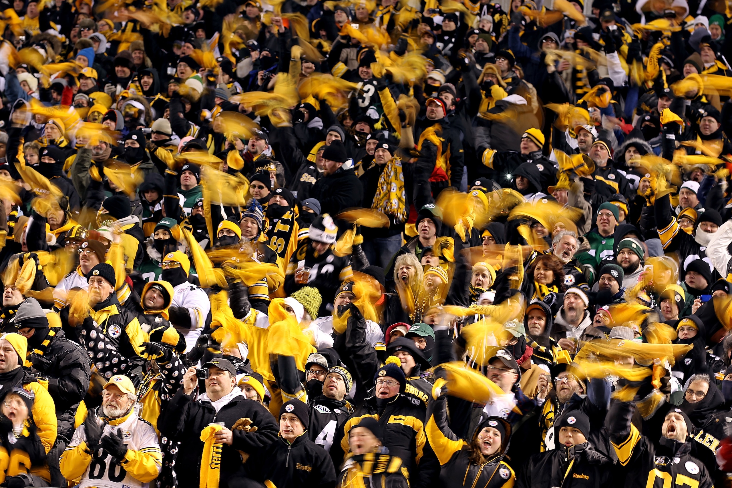 PITTSBURGH, PA - JANUARY 23:  Pittsburgh Steelers fans wave terrible towels during their 2011 AFC Championship game against the New York Jets at Heinz Field on January 23, 2011 in Pittsburgh, Pennsylvania.  (Photo by Al Bello/Getty Images)