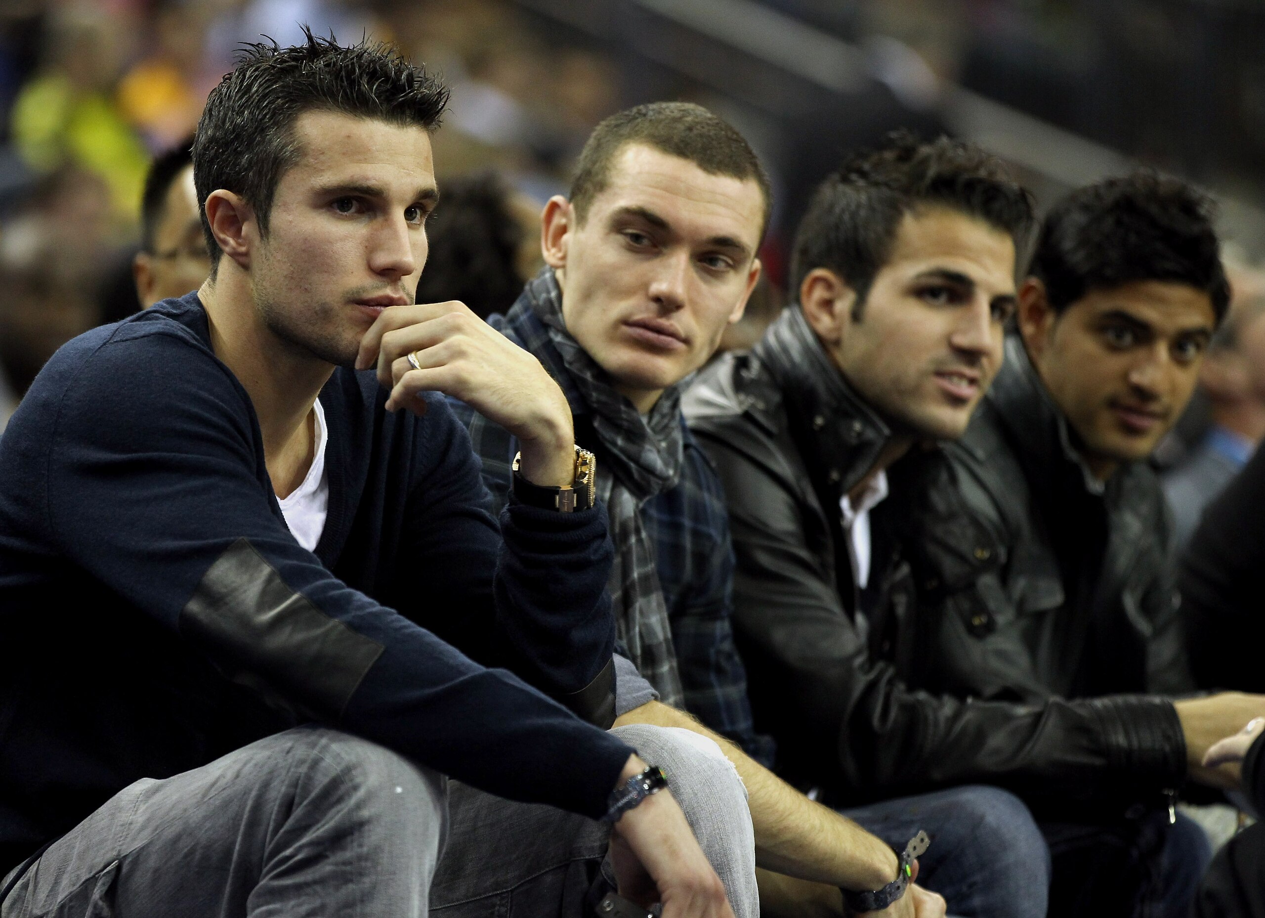 LONDON, ENGLAND - OCTOBER 04:  Arsenal footballers (L-R) Robin van Persie, Thomas Vermaelen, Francesc Fabregas and Carlos Vela during the NBA Europe Live match between the Los Angeles Lakers and the Minnesota Timberwolves at the O2 arena on October 4, 201