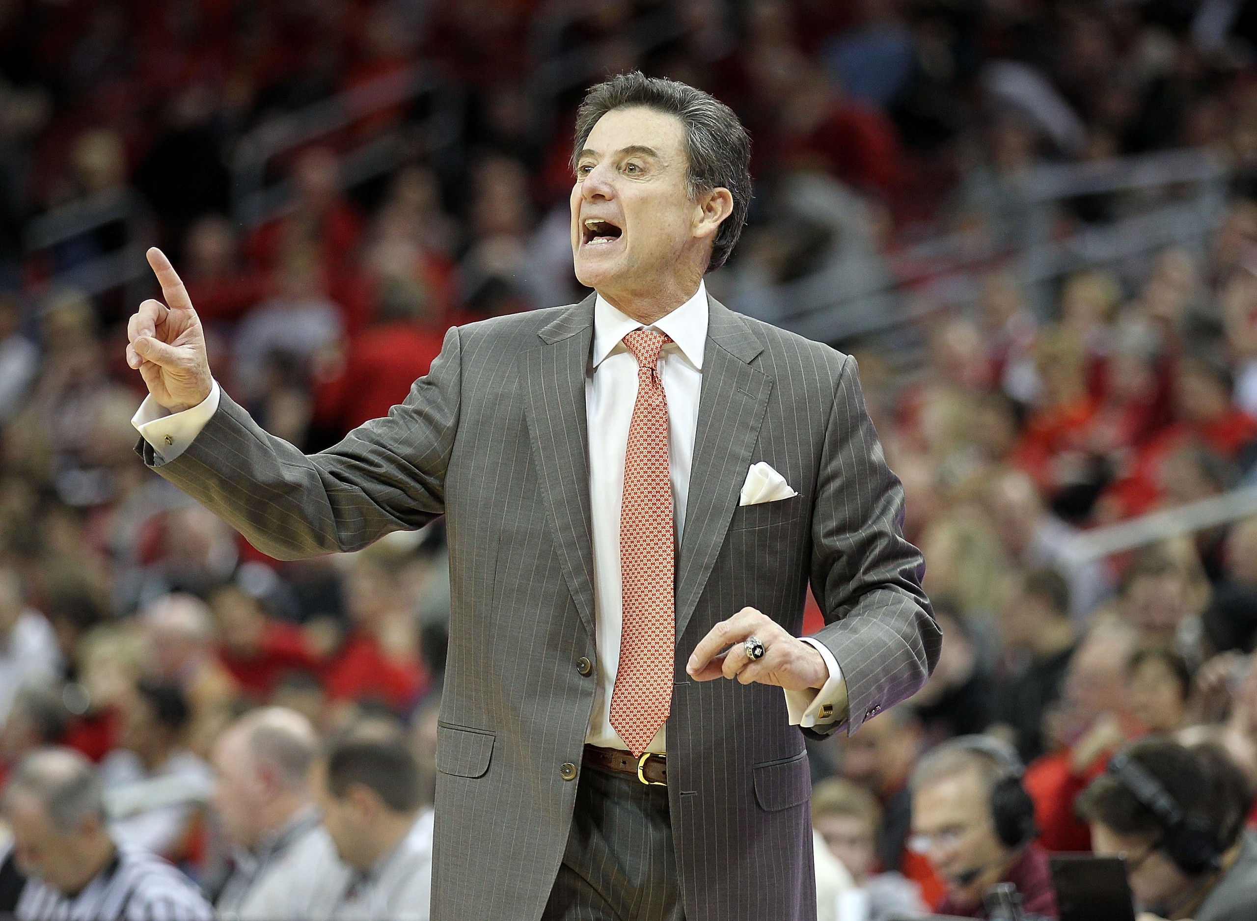 LOUISVILLE, KY - JANUARY 05:  Rick Pitino the Head Coach of the Louisville Cardinals gives instructions to his team during the Big East Conference game against the Seton Hall Pirates at the KFC Yum! Center on January 5, 2011 in Louisville, Kentucky.  (Pho