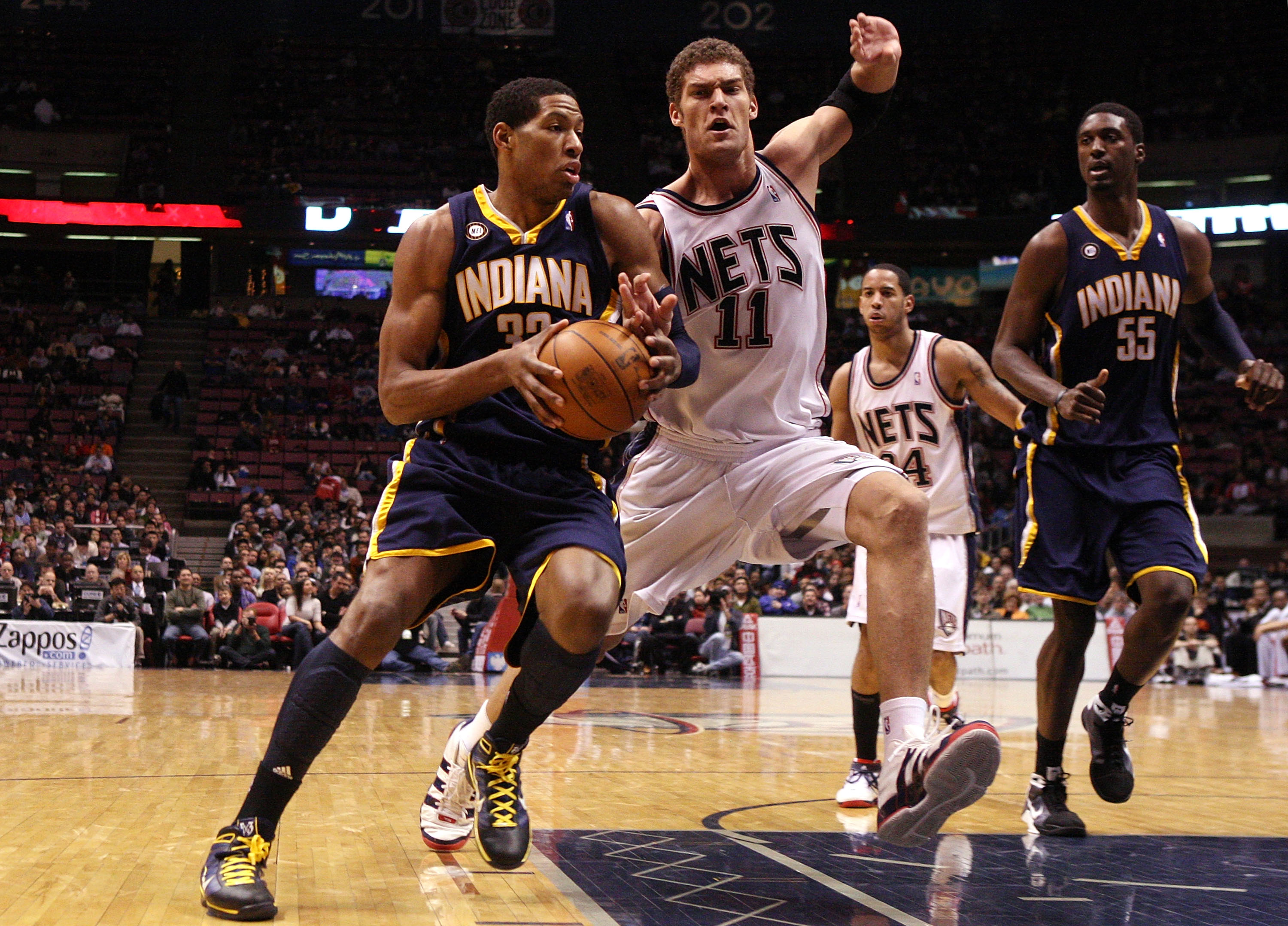 EAST RUTHERFORD, NJ - JANUARY 15:  Danny Granger #33 of the Indiana Pacers drives against Brook Lopez #11 of the New Jersey Nets at the Izod Center on January 15, 2010 in East Rutherford, New Jersey. NOTE TO USER: User expressly acknowledges and agrees th