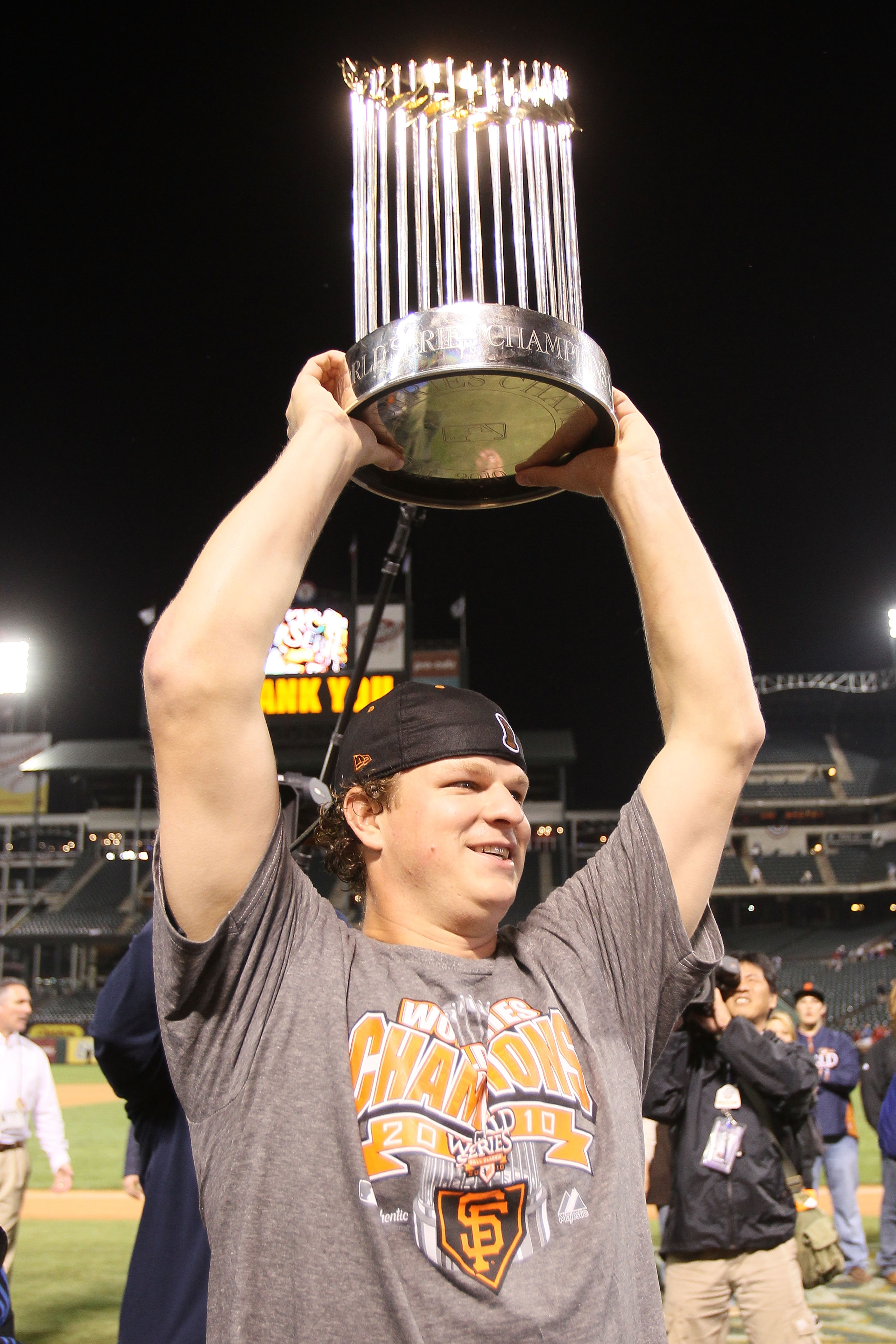 ARLINGTON, TX - NOVEMBER 01:  Matt Cain of the San Francisco Giants celebrates with the World Series Championship trophy out to the field after they won 3-1 against the Texas Rangers in Game Five of the 2010 MLB World Series at Rangers Ballpark in Arlingt