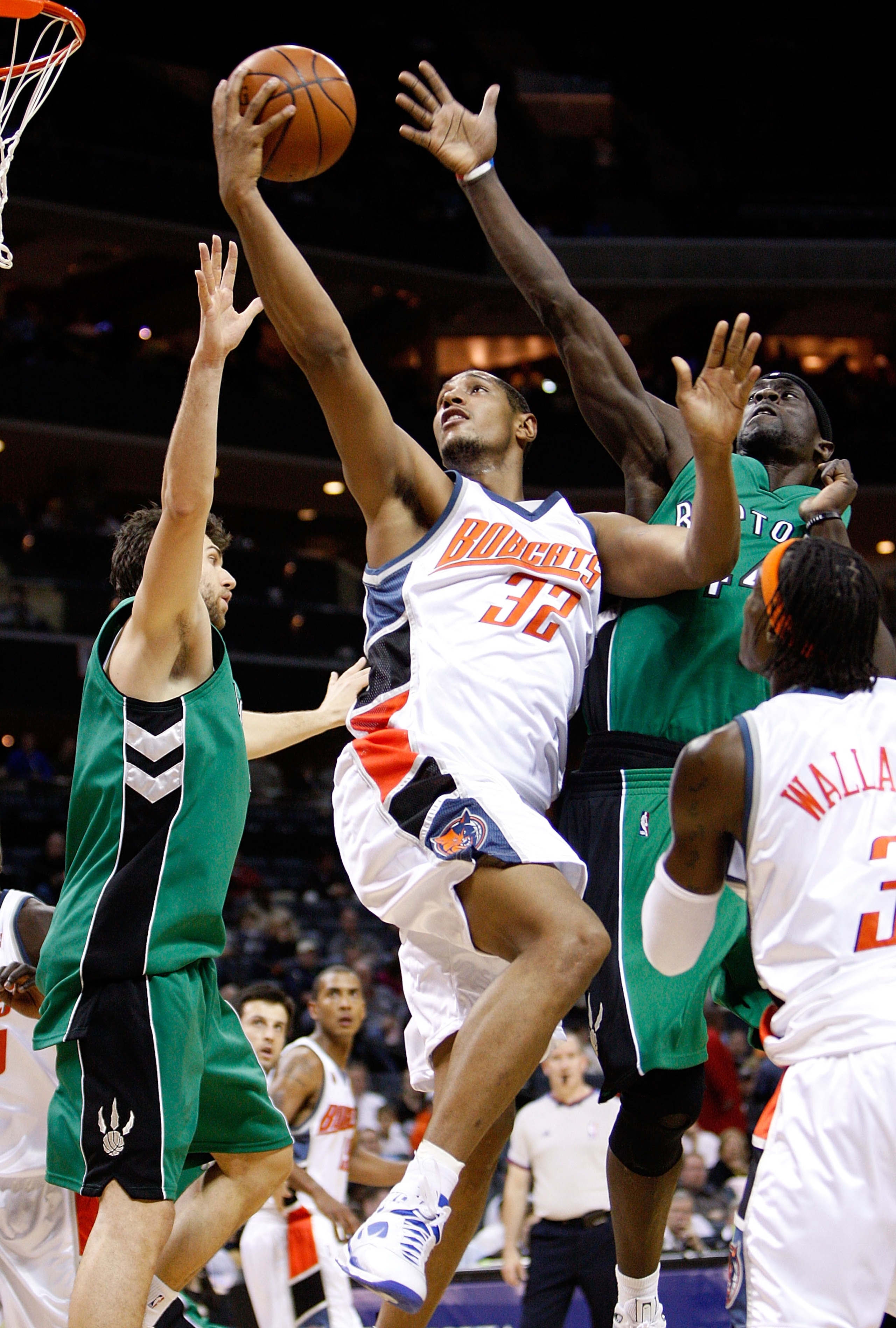 CHARLOTTE, NC - MARCH 16:  Pops Mensah-Bonsu #44 of the Toronto Raptors tries to block Boris Diaw #32 of the Charlotte Bobcats during their game at Time Warner Cable Arena on March 16, 2009 in Charlotte, North Carolina.  NOTE TO USER: User expressly ackno