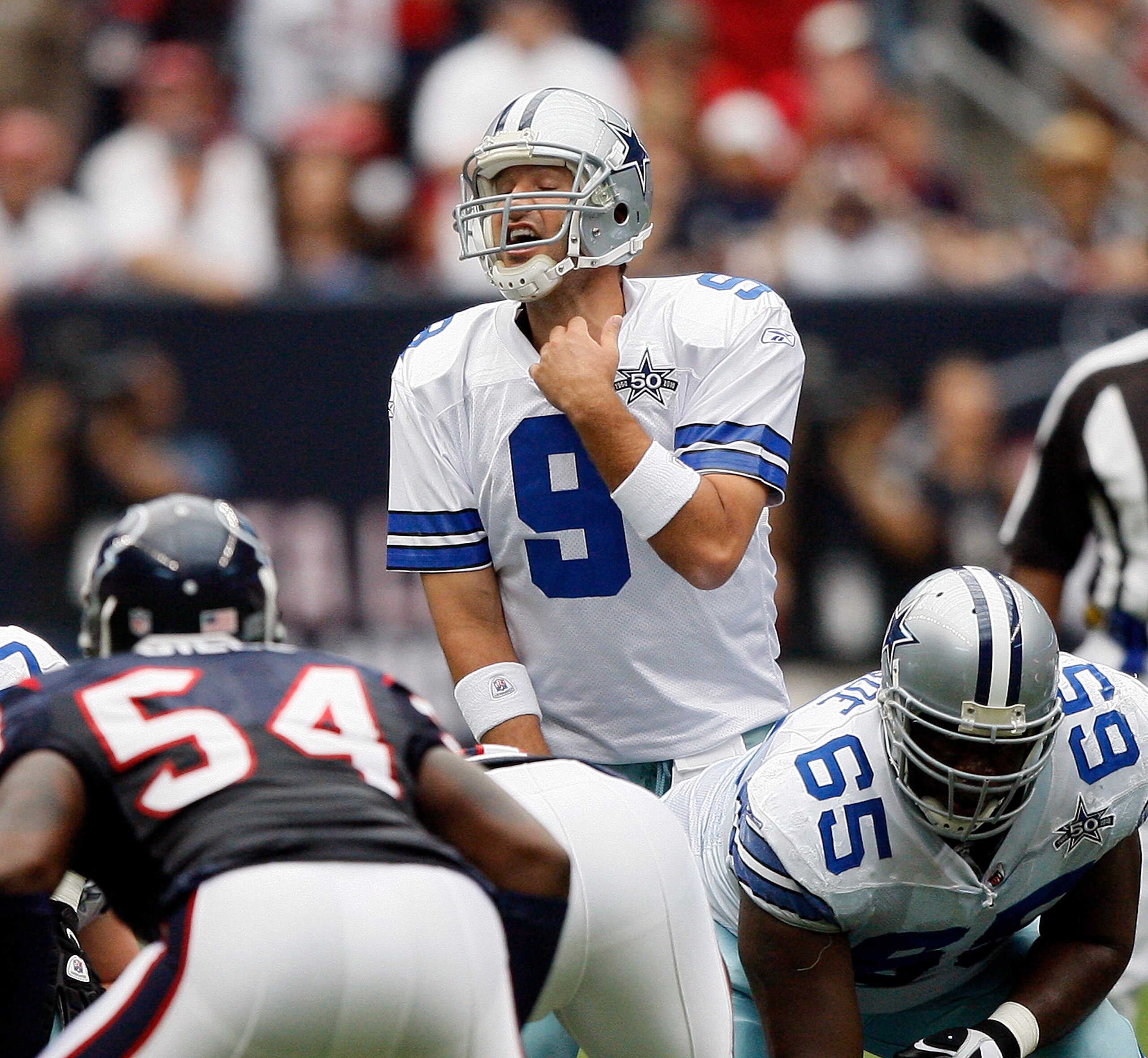 HOUSTON - SEPTEMBER 26: Quarterback Tony Romo #9 of the Dallas Cowboys makes an adjustment at the line of scrimmage against the Houston Texans at Reliant Stadium on September 26, 2010 in Houston, Texas. (Photo by Bob Levey/Getty Images) HOUSTON - SEPTEMBER 26: Quarterback Tony Romo #9 of the Dallas Cowboys makes an adjustment at the line of scrimmage against the Houston Texans at Reliant Stadium on September 26, 2010 in Houston, Texas. (Photo by Bob Levey/Getty Images)