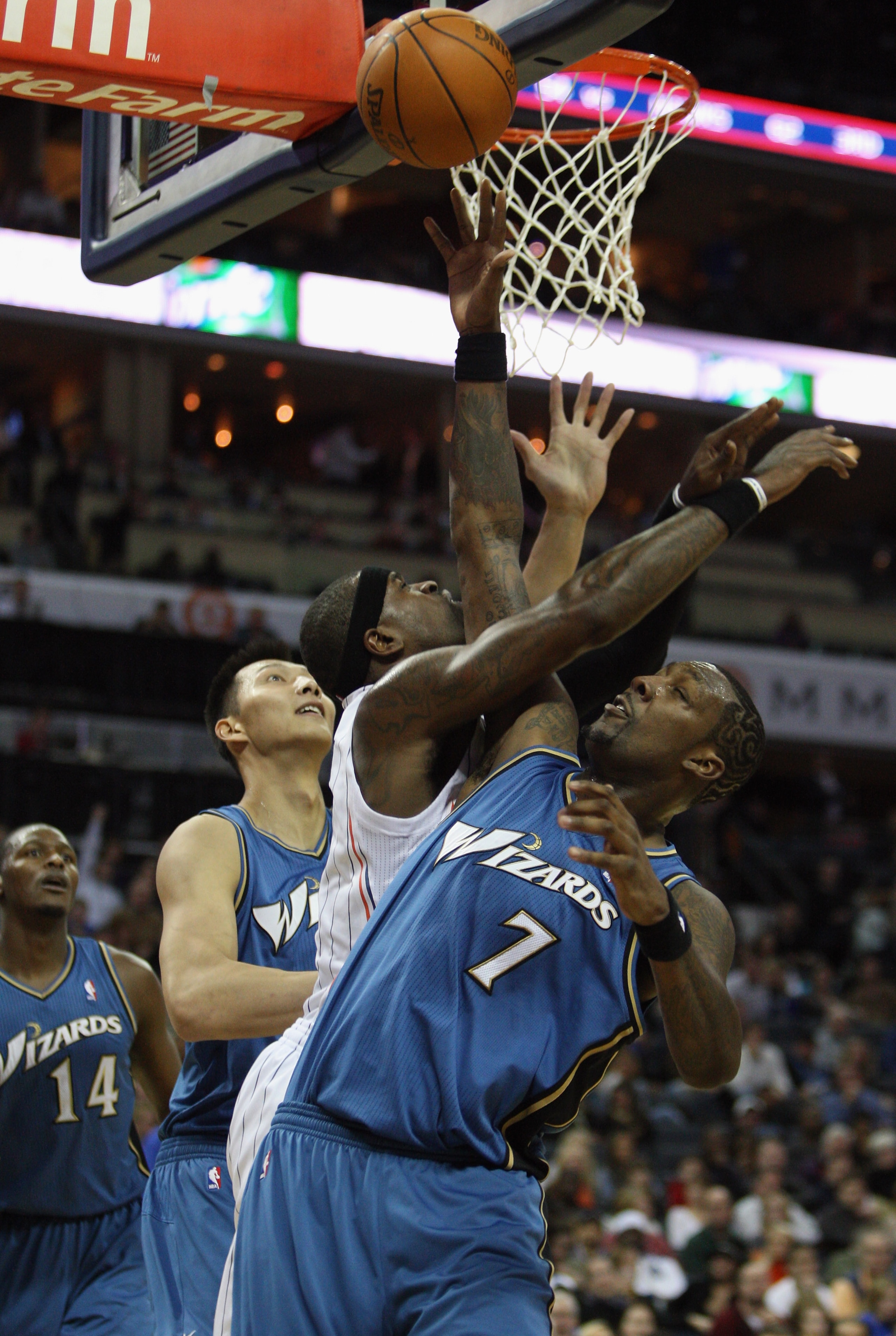 CHARLOTTE, NC - JANUARY 08:  Andray Blatche #7 of the Washington Wizards collides with Stephen Jackson #1 of the Charlotte Bobcats during their game at Time Warner Cable Arena on January 8, 2011 in Charlotte, North Carolina. NOTE TO USER: User expressly a