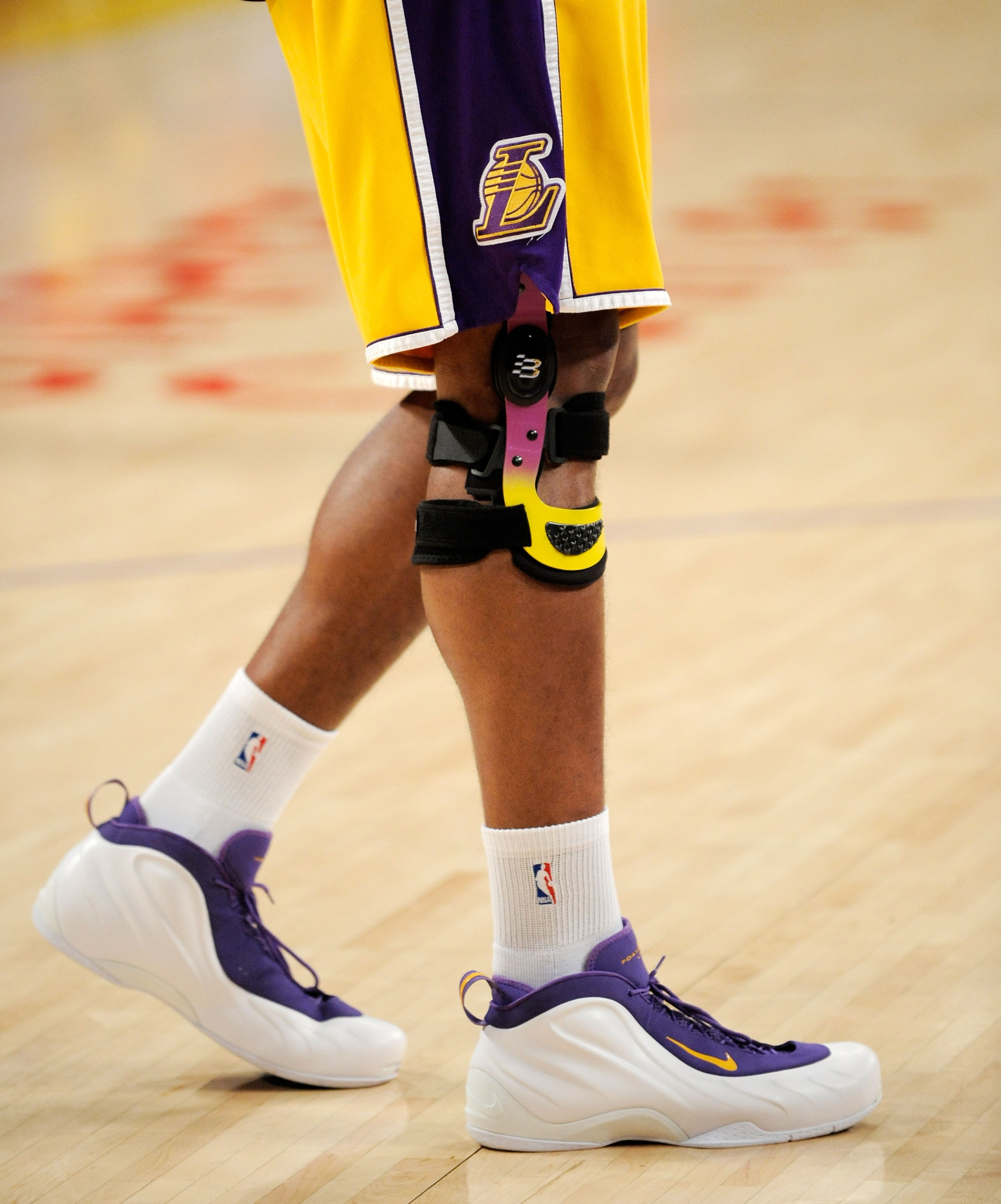 LOS ANGELES, CA - APRIL 9:  Andrew Bynum #17 of the Los Angeles Lakers wears a knee brace as he warms up before the start of the game against the Denver Nuggets, his first game back after suffering a torn medial collateral ligament in his right knee on Ja