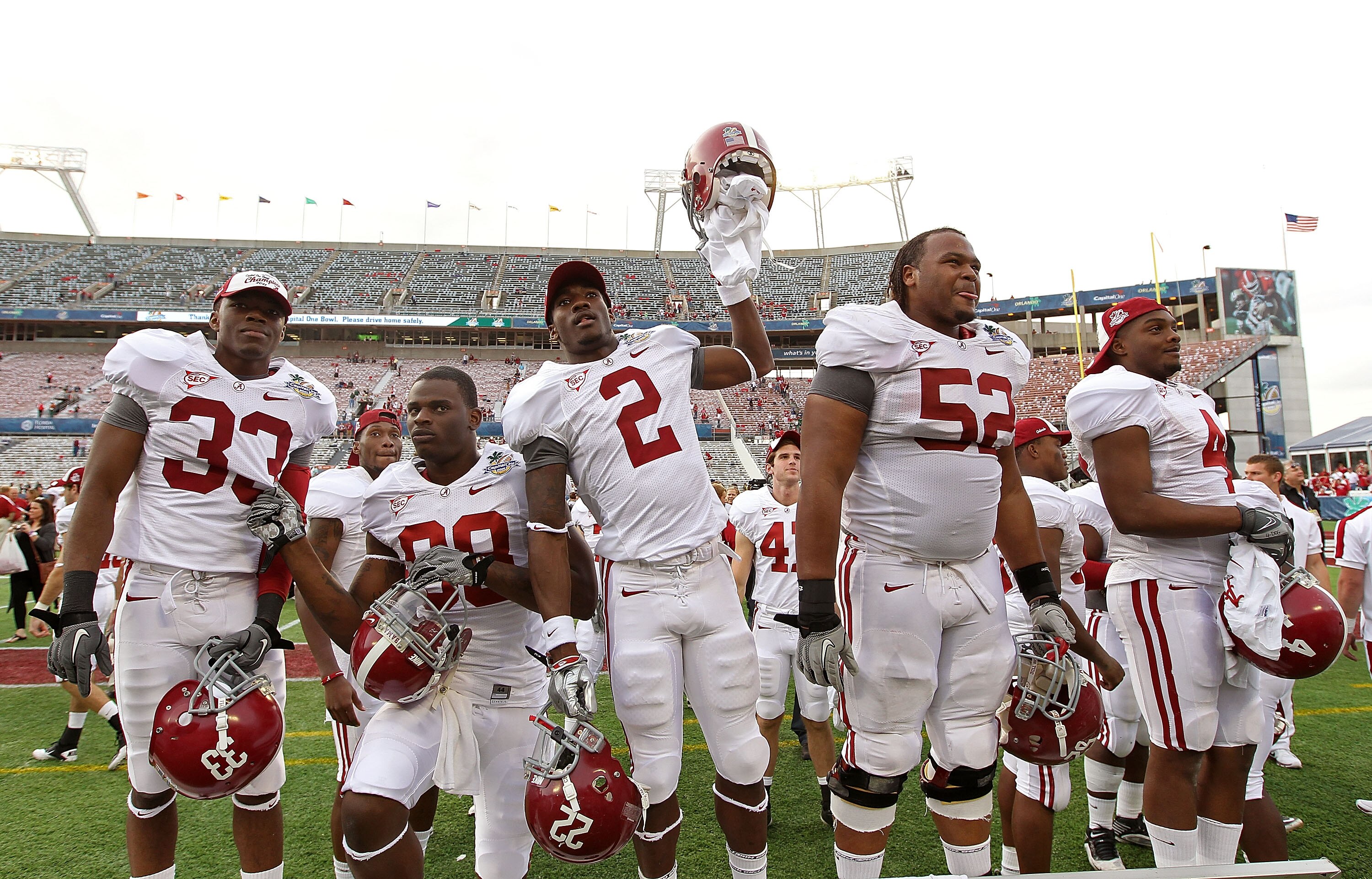 ORLANDO, FL - JANUARY 01:  Players from the Alabama Crimson Tide greet fans after winning the Capitol One Bowl against the Michigan State Spartans at the Florida Citrus Bowl on January 1, 2011 in Orlando, Florida.  (Photo by Mike Ehrmann/Getty Images)