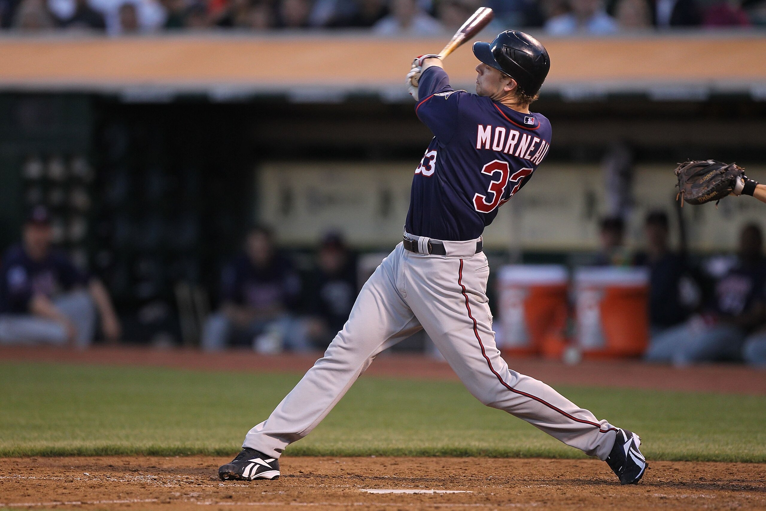 OAKLAND, CA - JUNE 04:  Justin Morneau #33 of the Minnesota Twins bats against the Oakland Athletics during an MLB game at the Oakland-Alameda County Coliseum on June 4, 2010 in Oakland, California.  (Photo by Jed Jacobsohn/Getty Images)