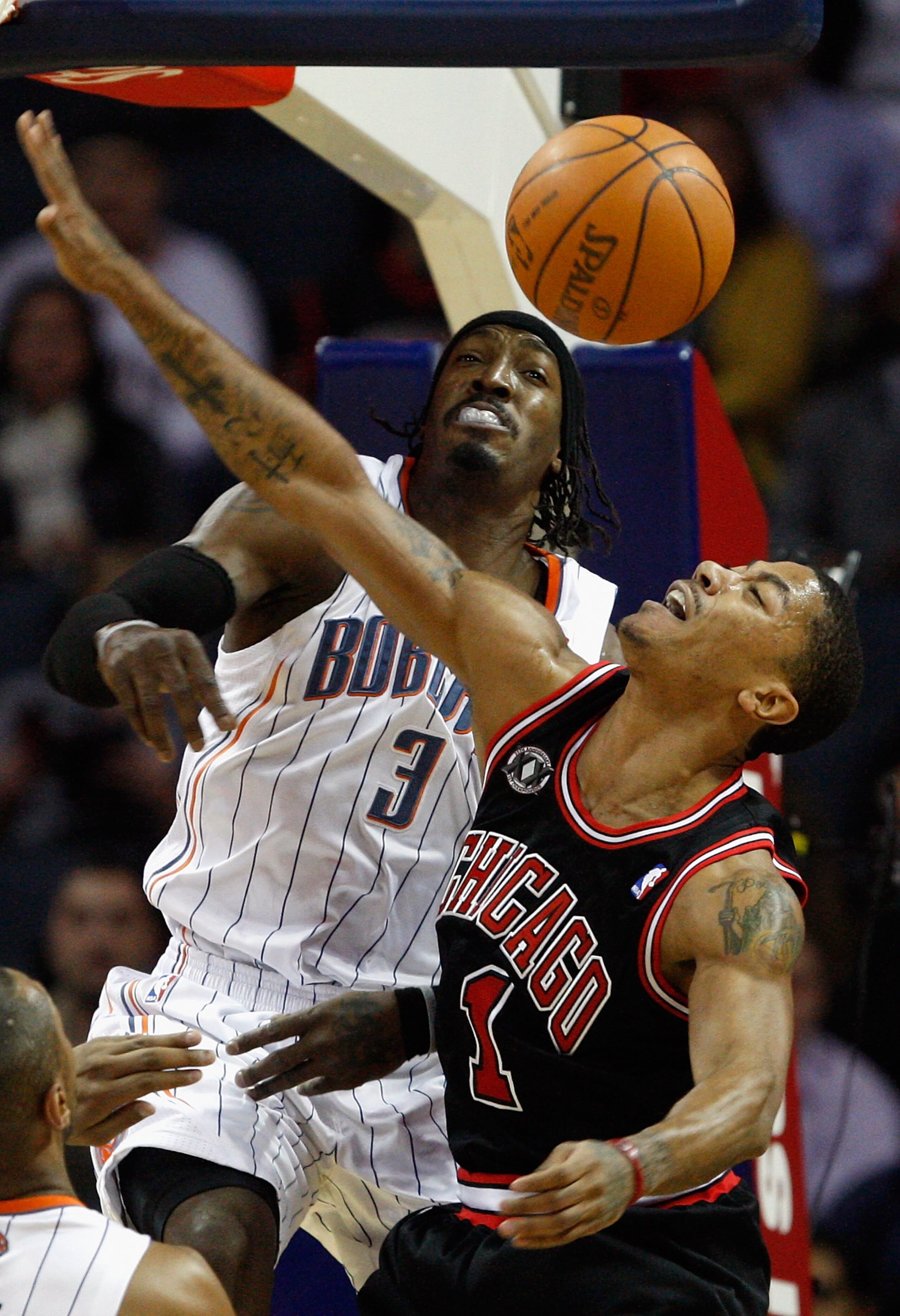 CHARLOTTE, NC - JANUARY 12: Derrick Rose #1 of the Chicago Bulls has his shot blocked by Gerald Wallace #3 of the Charlotte Bobcats during their game at Time Warner Cable Arena on January 12, 2011 in Charlotte, North Carolina. NOTE TO USER: User expressl CHARLOTTE, NC - JANUARY 12: Derrick Rose #1 of the Chicago Bulls has his shot blocked by Gerald Wallace #3 of the Charlotte Bobcats during their game at Time Warner Cable Arena on January 12, 2011 in Charlotte, North Carolina. NOTE TO USER: User expressl