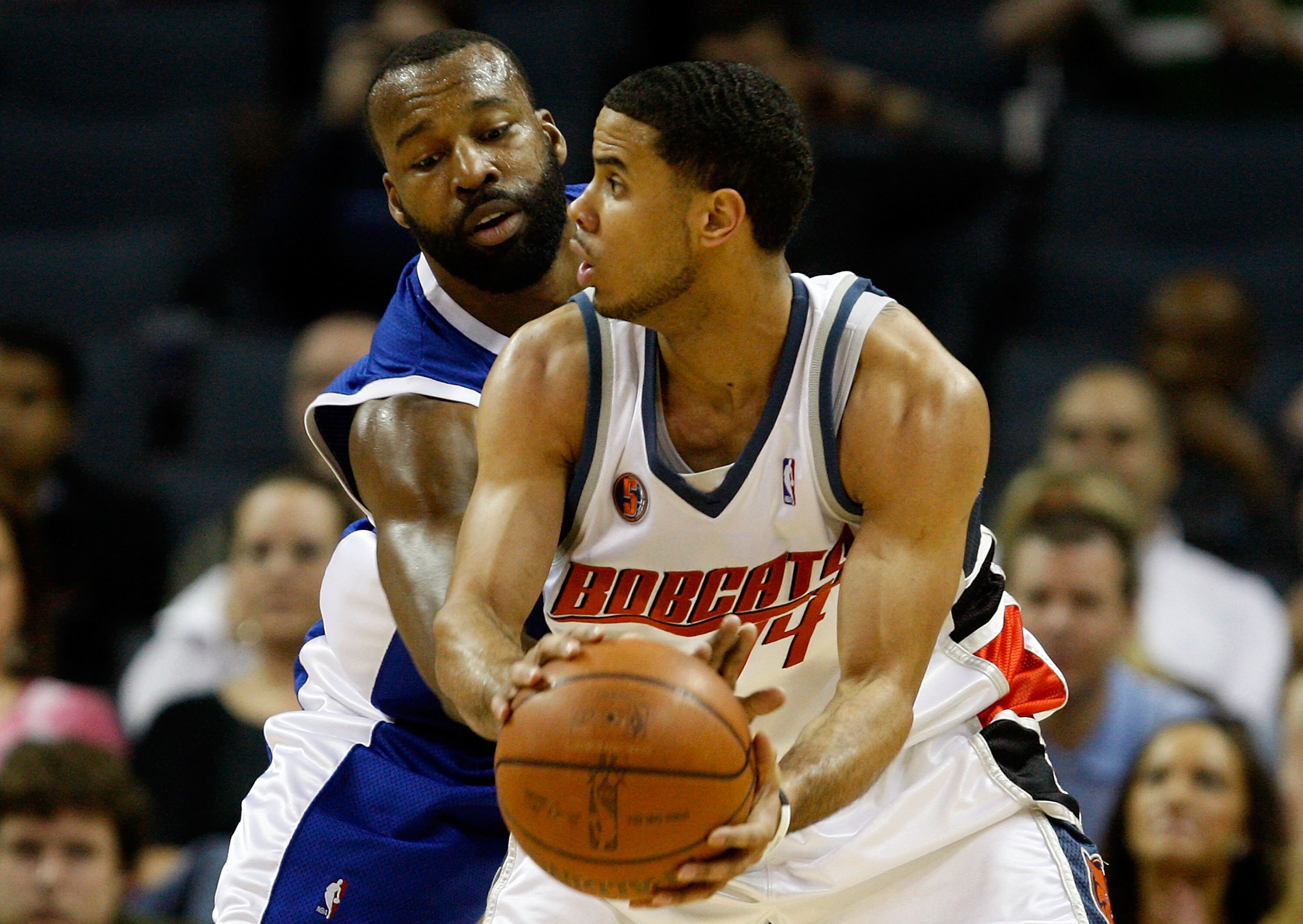 CHARLOTTE, NC - FEBRUARY 09: Baron Davis #1 of the Los Angeles Clippers tries to steal the ball from D.J. Augustin #14 of the Charlotte Bobcats during their game at Time Warner Cable Arena on February 9, 2009 in Charlotte, North Carolina. NOTE TO USER: U