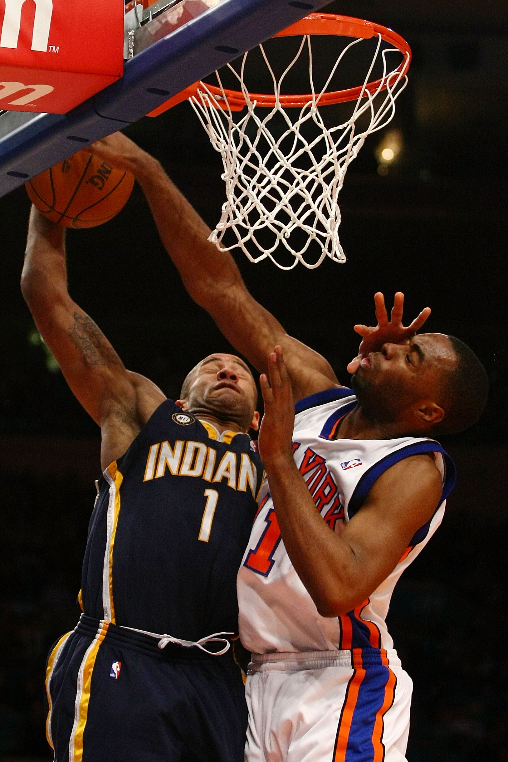 NEW YORK - JANUARY 03: Dahntay Jones #1 of the Indiana Pacers has his shot rejected by Marcus Landry #11 of the New York Knicks at Madison Square Garden January 3, 2010 in New York City. NOTE TO USER: User expressly acknowledges and agrees that, by downlo