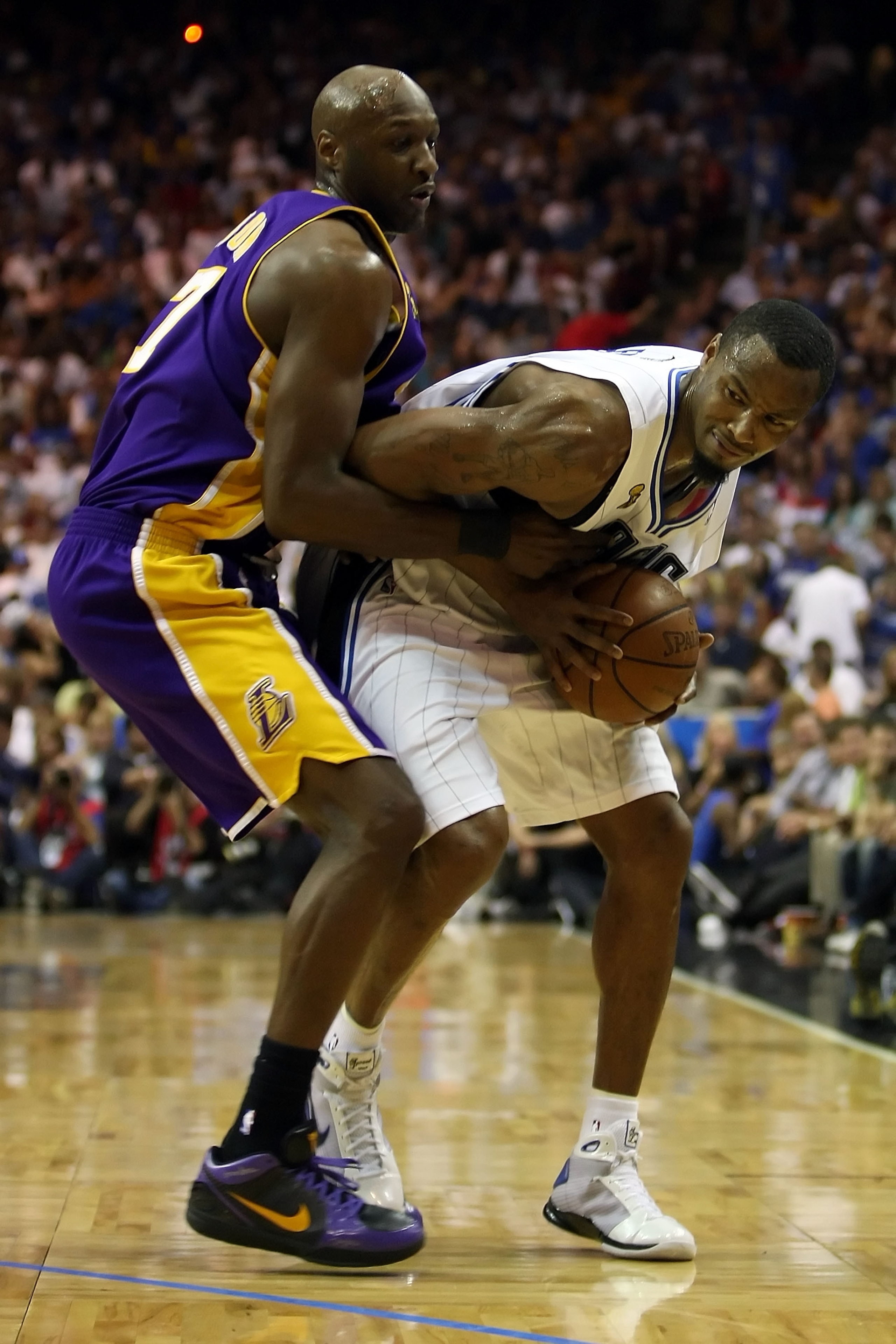ORLANDO, FL - JUNE 11:  Rashard Lewis #9 of the Orlando Magic is guarded by Lamar Odom #7 of the Los Angeles Lakers in Game Four of the 2009 NBA Finals on June 11, 2009 at Amway Arena in Orlando, Florida.  NOTE TO USER:  User expressly acknowledges and ag