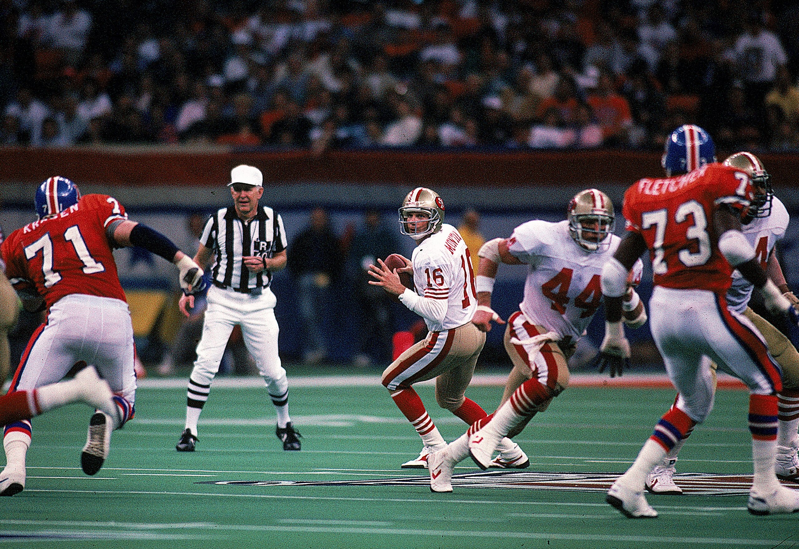 28 Jan 1990:  Quarterback Joe Montana #16 of the San Francisco 49ers in action during the NFL Super Bowl XXIV Game against Denver Broncos at the Louisiana Superdome in New Orleans, Louisiana. The 49ers defeated the Broncos 55-10. Mandatory Credit: Rick St