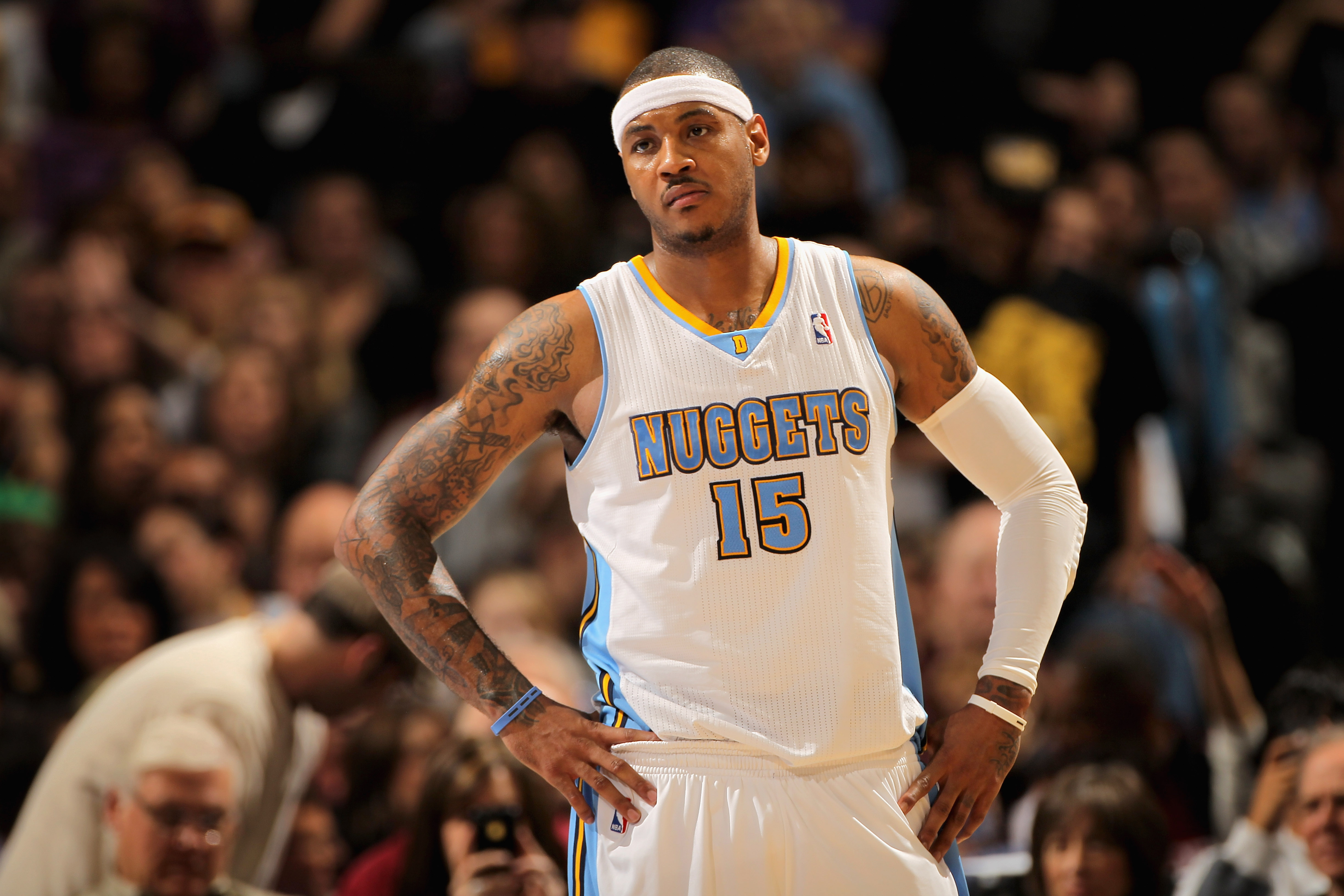 DENVER, CO - JANUARY 21:  Carmelo Anthony #15 of the Denver Nuggets looks on during a break in the action against the Los Angeles Lakers at the Pepsi Center on January 21, 2011 in Denver, Colorado. The Lakers defeated the Nuggets 107-97. NOTE TO USER: Use