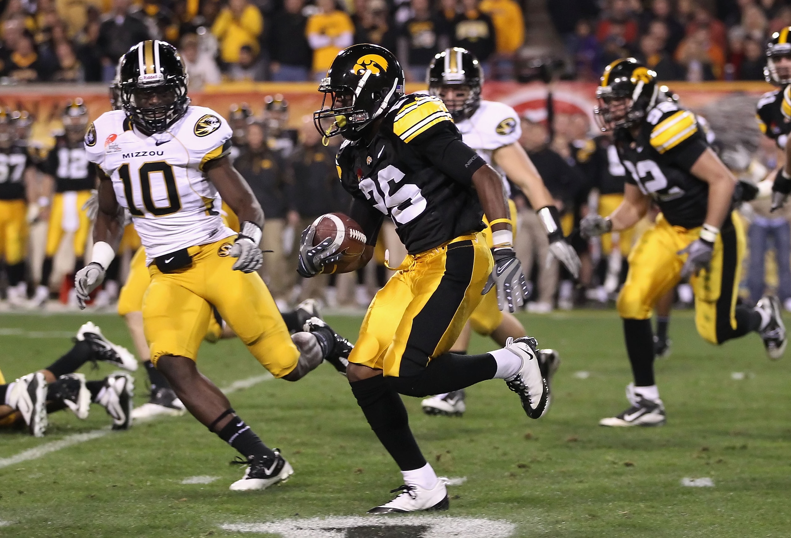 TEMPE, AZ - DECEMBER 28:  Wide receiver Paul Chaney, Jr. of the Iowa Hawkeyes runs with the football against the Missouri Tigers during the Insight Bowl at Sun Devil Stadium on December 28, 2010 in Tempe, Arizona.  (Photo by Christian Petersen/Getty Image