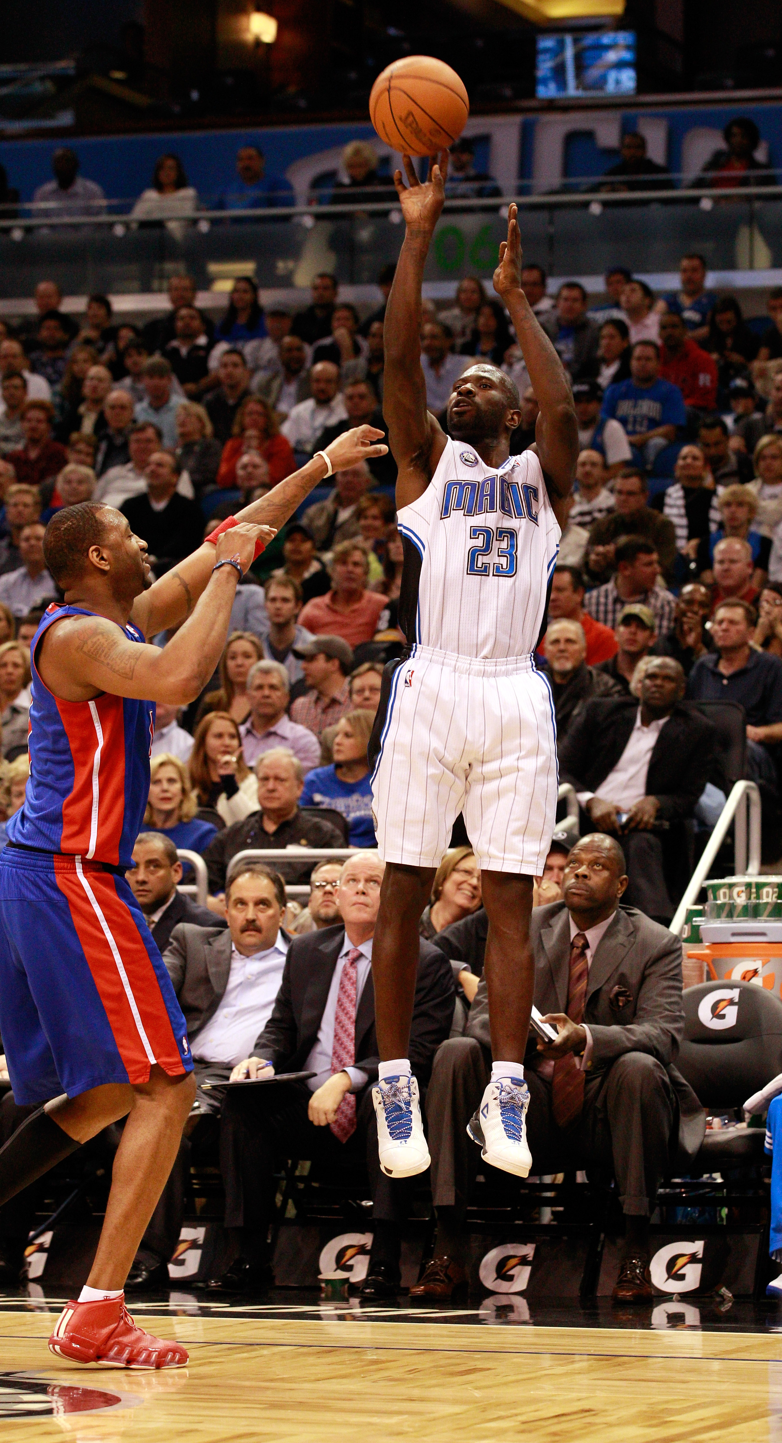 ORLANDO, FL - JANUARY 24:  Jason Richardson #23 of the Orlando Magic attempts a shot over Tracy McGrady #1 of the Detroit Pistons during the game at Amway Arena on January 24, 2011 in Orlando, Florida.  NOTE TO USER: User expressly acknowledges and agrees