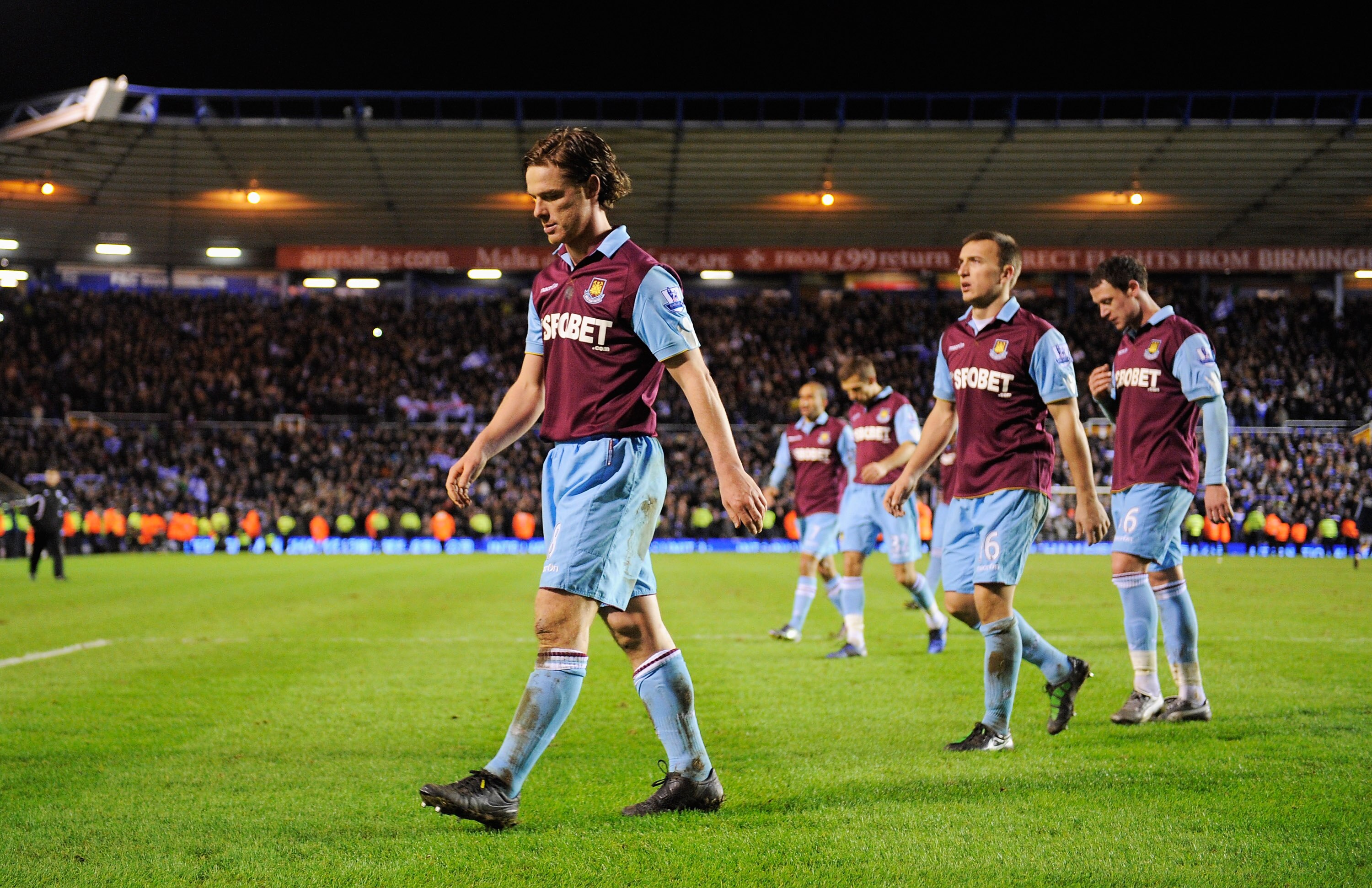 BIRMINGHAM, ENGLAND - JANUARY 26:  Scott Parker of West Ham United walks off dejected with team mates after the Carling Cup Semi Final Second Leg match between Birmingham City and West Ham United at St Andrews on January 26, 2011 in Birmingham, England.  