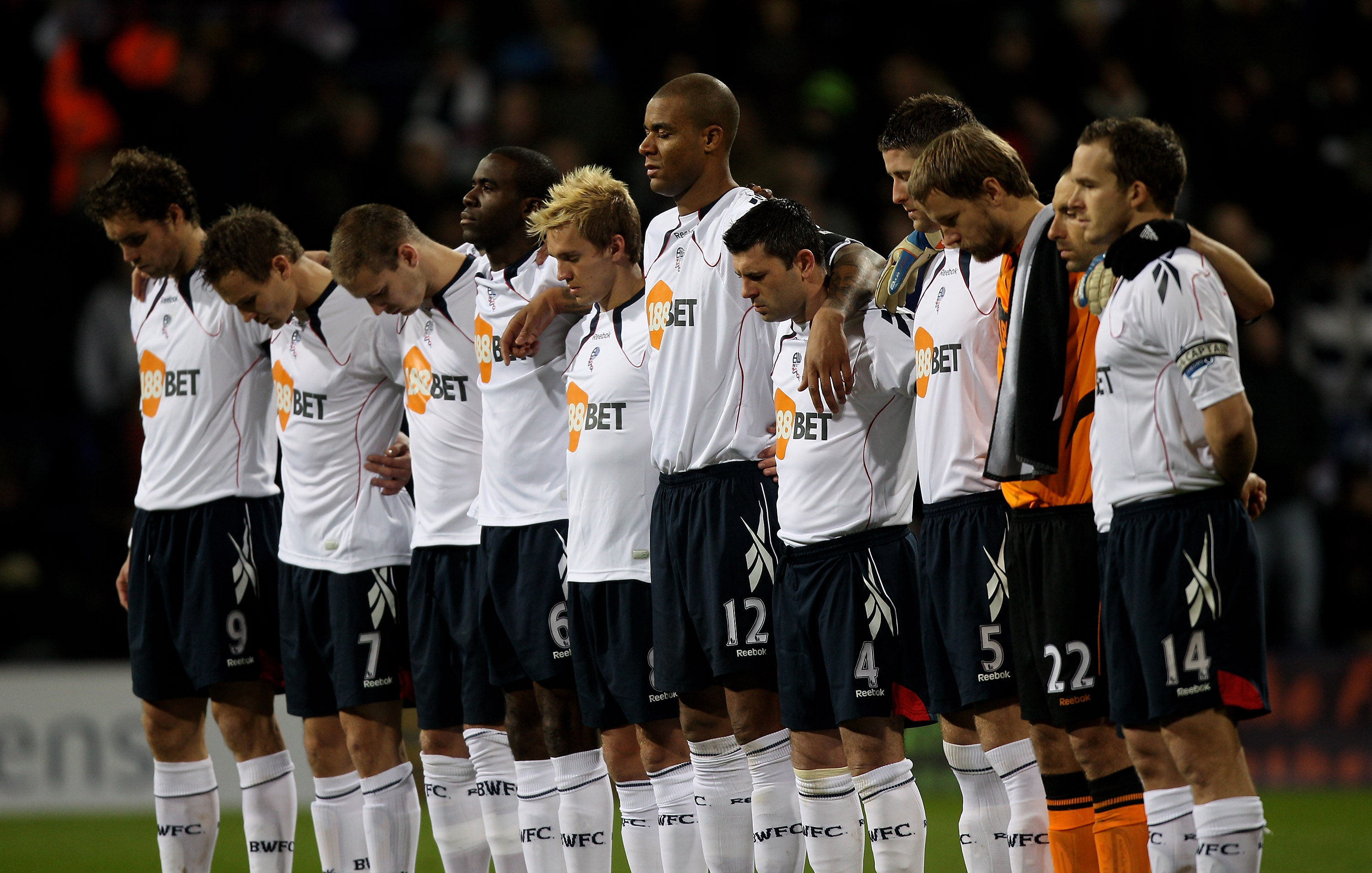 BOLTON, ENGLAND - JANUARY 24:  The Bolton Wanderers players observes a minutes silence for the late Nat Lofthouse prior to the Barclays Premier League match between Bolton Wanderers and Chelsea at the Reebok Stadium on January 24, 2011 in Bolton, England.