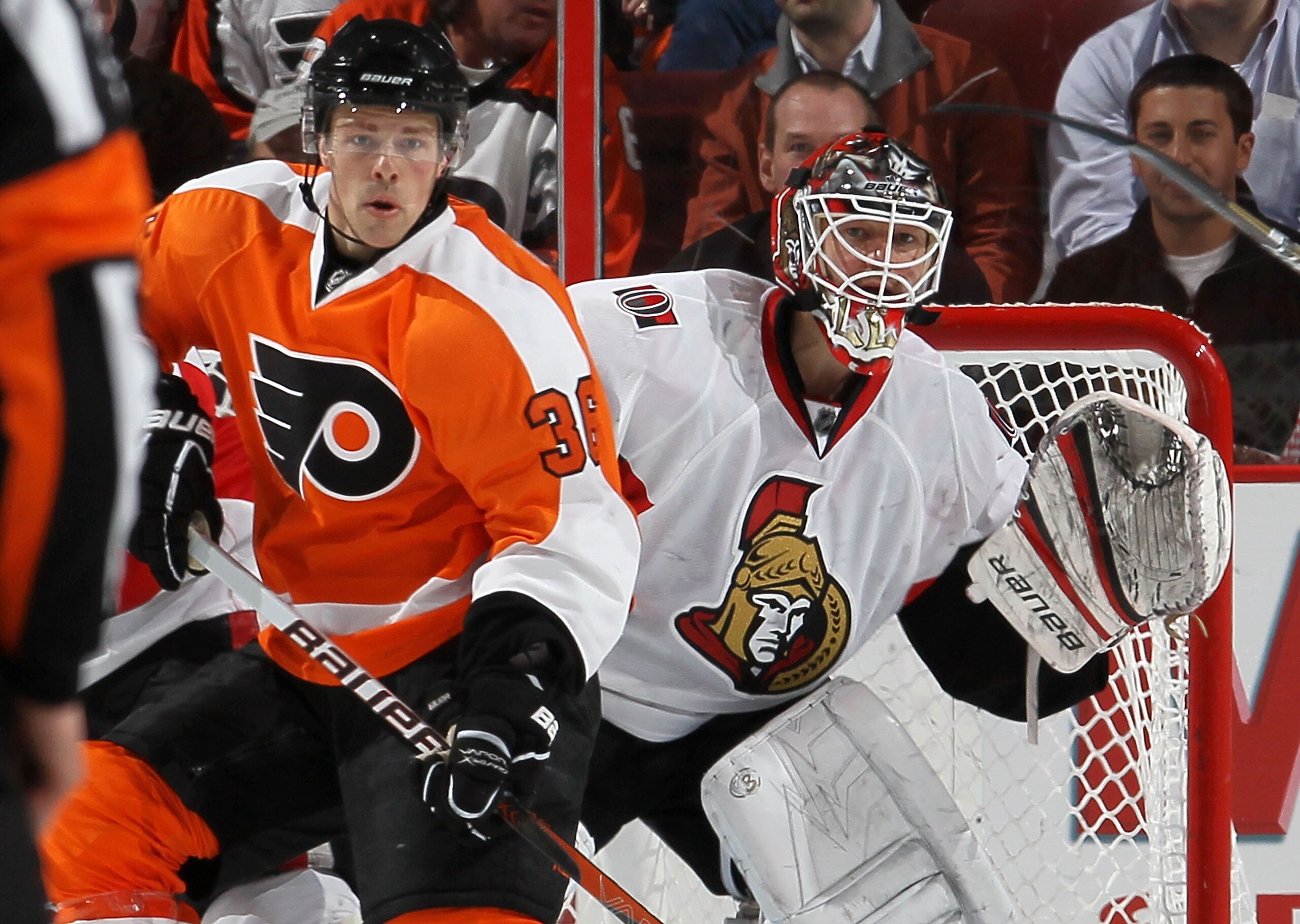 PHILADELPHIA, PA - JANUARY 20:  Brian Elliot #30 of the Ottawa Senators defends against Darroll Powe #36 of the Philadelphia Flyers on January 20, 2011 at Wells Fargo Center in Philadelphia, Pennsylvania.  (Photo by Jim McIsaac/Getty Images)