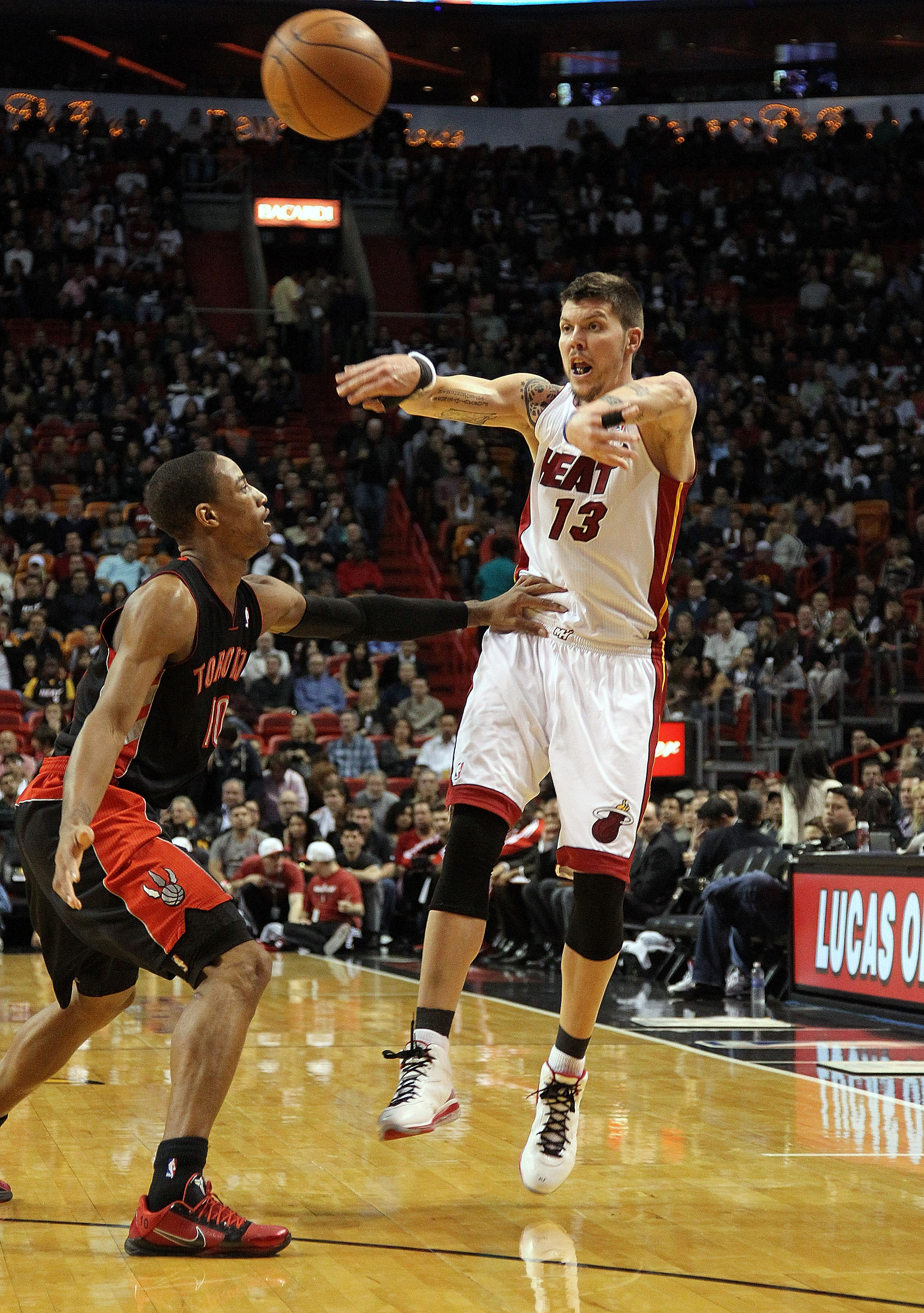 MIAMI, FL - JANUARY 22:  Mike Miller #13 of the Miami Heat spasses the ball during a game against the Toronto Raptors at American Airlines Arena on January 22, 2011 in Miami, Florida. NOTE TO USER: User expressly acknowledges and agrees that, by downloadi