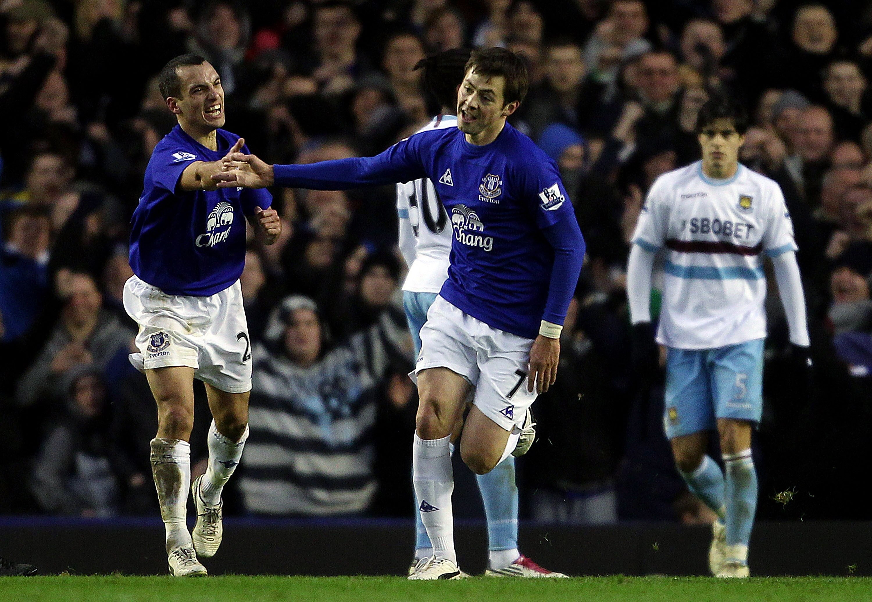 LIVERPOOL, ENGLAND - JANUARY 22:  Diniyar Bilyaletdinov of Everton celebrates with Leon Osman after scoring their first goal during the Barclays Premier League match at Goodison Park on January 22, 2011 in Liverpool, England.  (Photo by Scott Heavey/Getty