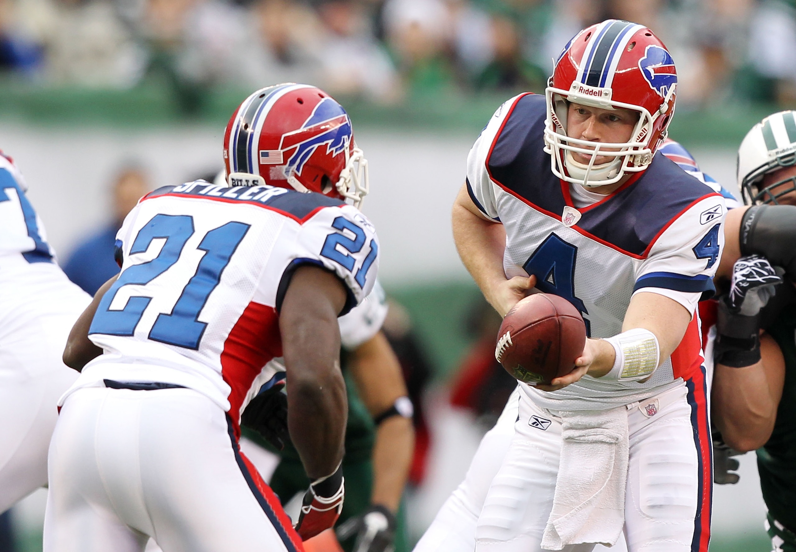 EAST RUTHERFORD, NJ - JANUARY 02:  Brian Brohm #4 and C.J. Spiller #21 of the Buffalo Bills run a play against the New York Jets at New Meadowlands Stadium on January 2, 2011 in East Rutherford, New Jersey.  (Photo by Al Bello/Getty Images)
