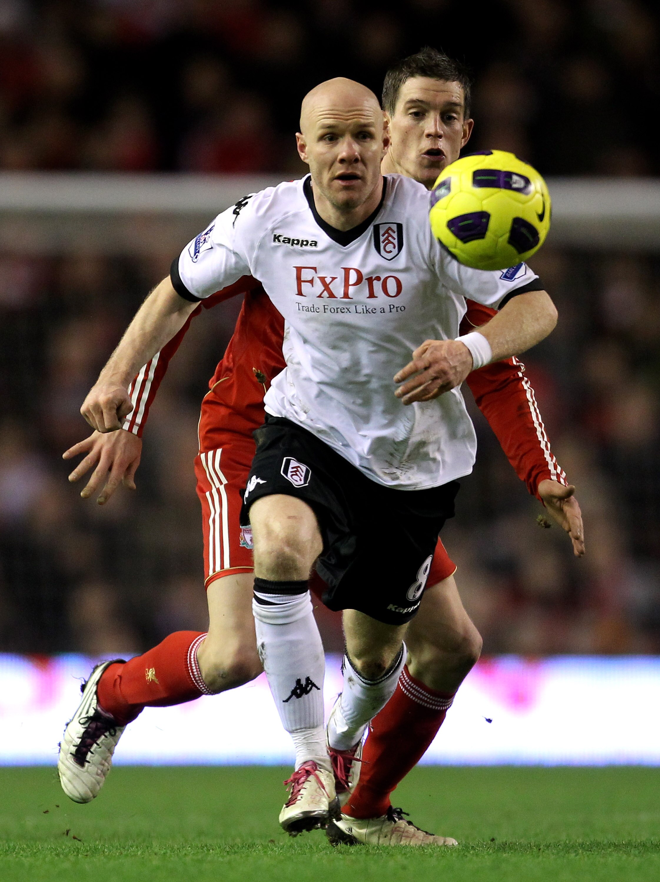 LIVERPOOL, ENGLAND - JANUARY 26:  Andy Johnson of Fulham is challenged by Daniel Agger of Liverpool during the Barclays Premier League match between Liverpool and Fulham at Anfield on January 26, 2011 in Liverpool, England.  (Photo by Alex Livesey/Getty I