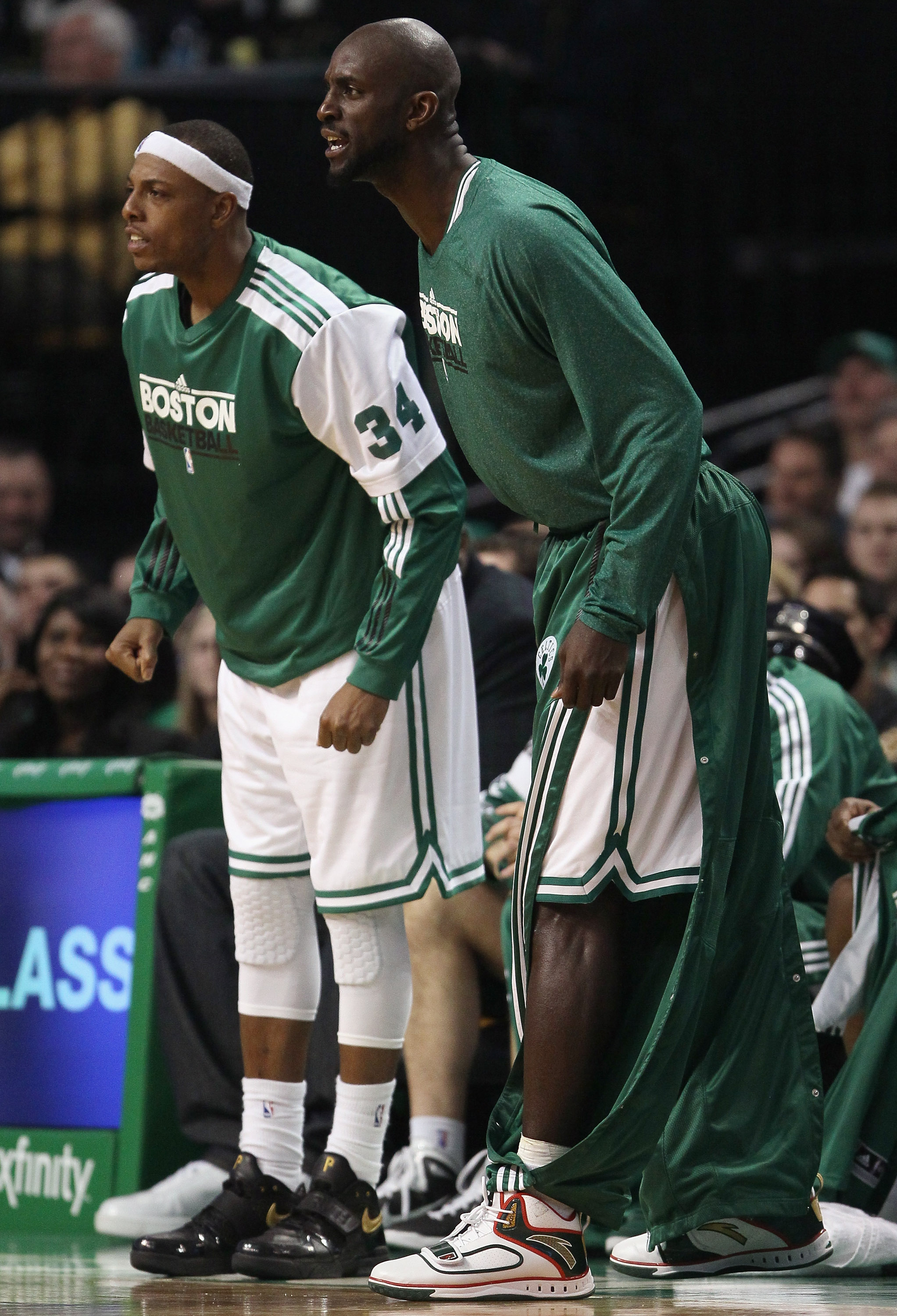 BOSTON, MA - JANUARY 25:  Paul Pierce #34 and Kevin Garnett #5 of the Boston Celitcs cheer on their teammates in the second half against the Cleveland Cavaliers on January 25, 2011 at the TD Garden in Boston, Massachusetts. The Celtics defeated the Cavali