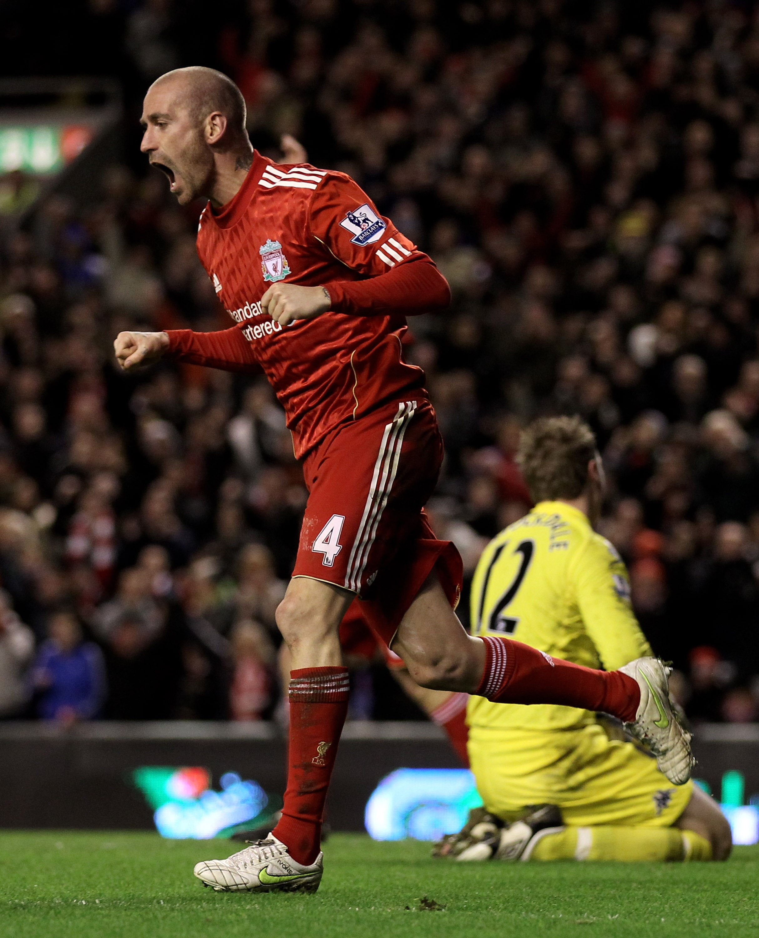 LIVERPOOL, ENGLAND - JANUARY 26:  Raul Meireles of Liverpool celebrates after John Pantsil of Fulham scored an own goal during the Barclays Premier League match between Liverpool and Fulham at Anfield on January 26, 2011 in Liverpool, England.  (Photo by 
