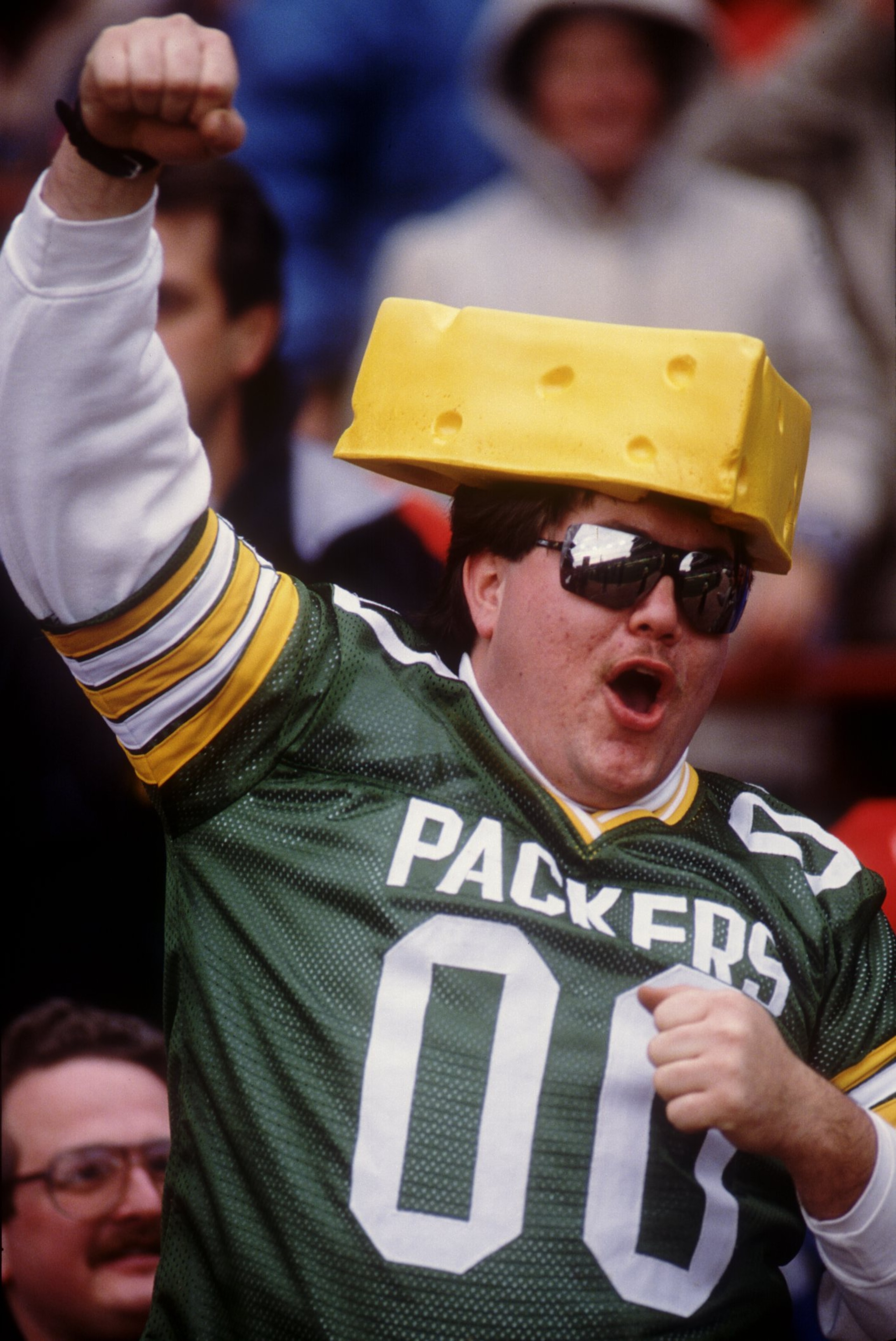 10 NOV 1991:  A CHEESEHEAD FAN SUPPORTS HIS TEAM, THE GREEN BAY PACKERS, DURING THE PACKERS 34-24 LOSS TO THE BUFFALO BILLS AT Milwaukee County Stadium in Milwaukee, Wisconsin.  Mandatory Credit: Jonathan Daniel/ALLSPORT