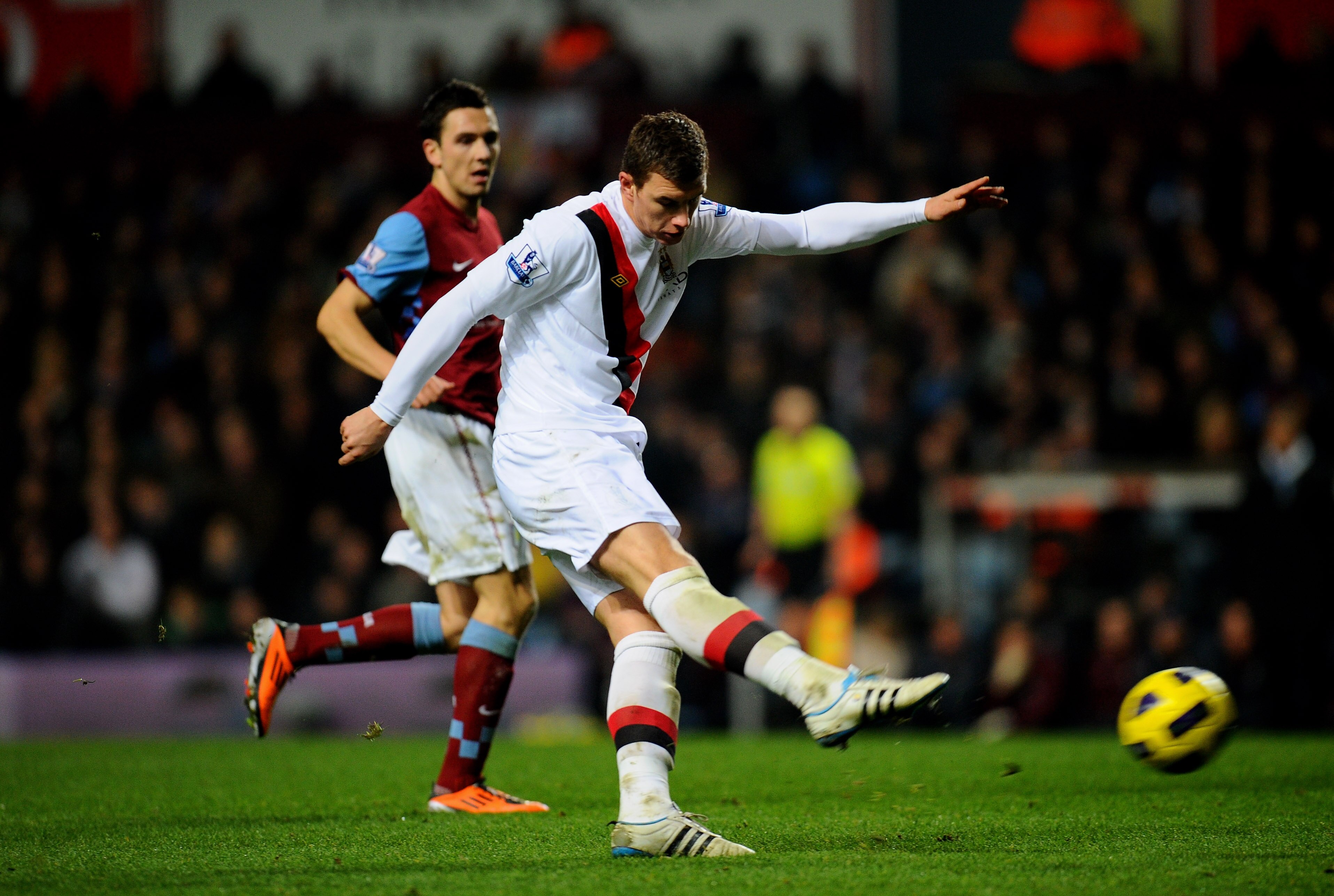 BIRMINGHAM, ENGLAND - JANUARY 22:  Edin Dzeko of Manchester City takes a shot on goal during the Barclays Premier League match between Aston Villa and Manchester City at Villa Park on January 22, 2011 in Birmingham, England.  (Photo by Clive Mason/Getty I