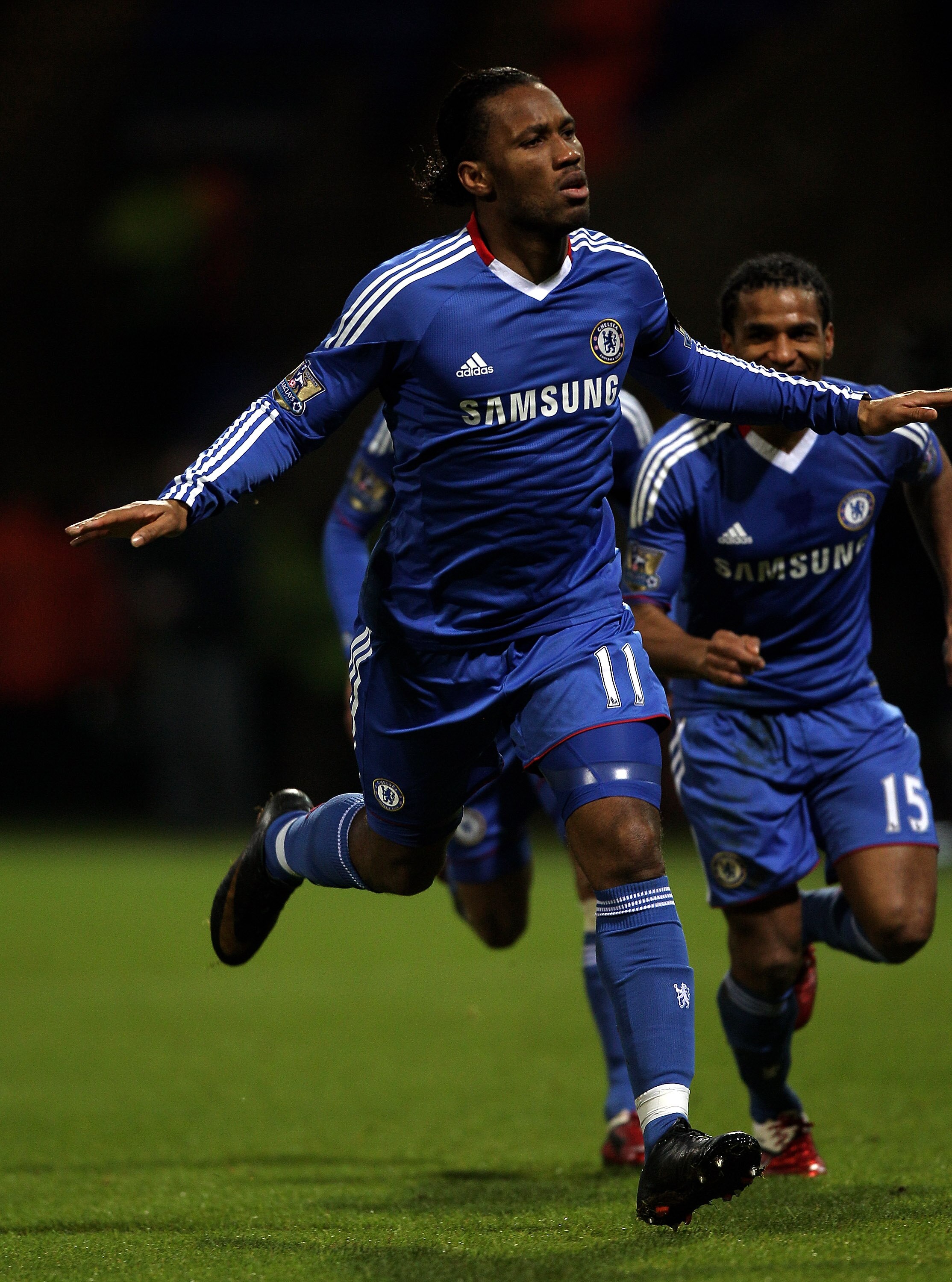 BOLTON, ENGLAND - JANUARY 24:  Didier Drogba of Chelsea celebrates scoring the opening goal during the Barclays Premier League match between Bolton Wanderers and Chelsea at the Reebok Stadium on January 24, 2011 in Bolton, England.  (Photo by Michael Stee