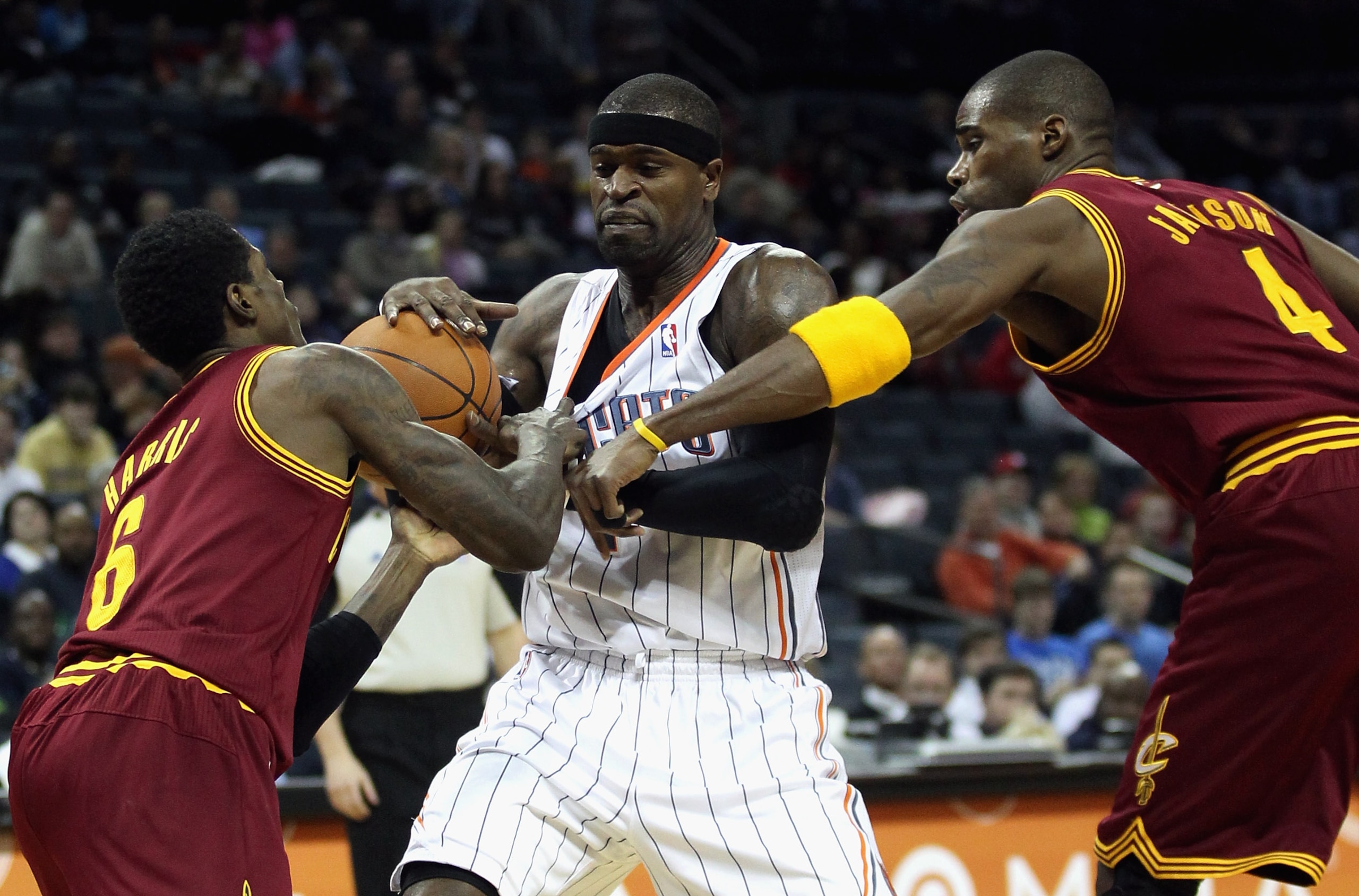 CHARLOTTE, NC - DECEMBER 29:  Teammates Manny Harris #6 and Antawn Jamison #4 of the Cleveland Cavaliers battle for a loose ball with Stephen Jackson #1 of the Charlotte Bobcats during their game at Time Warner Cable Arena on December 29, 2010 in Charlott