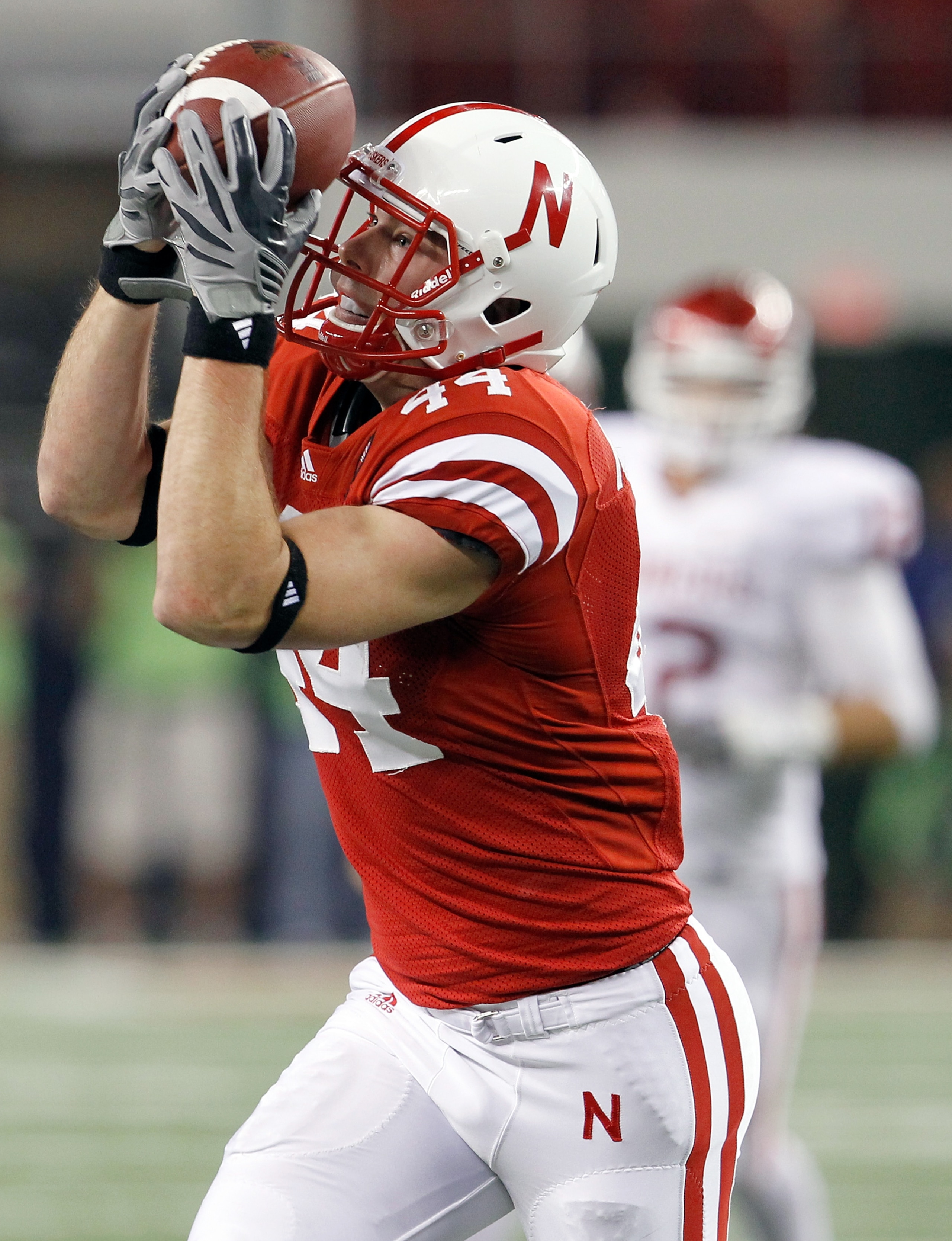 ARLINGTON, TX - DECEMBER 04:  Wide receiver Mike McNeil #44 of the Nebraska Cornhuskers pulls in a pass against the Oklahoma Sooners at Cowboys Stadium on December 4, 2010 in Arlington, Texas.  (Photo by Tom Pennington/Getty Images)