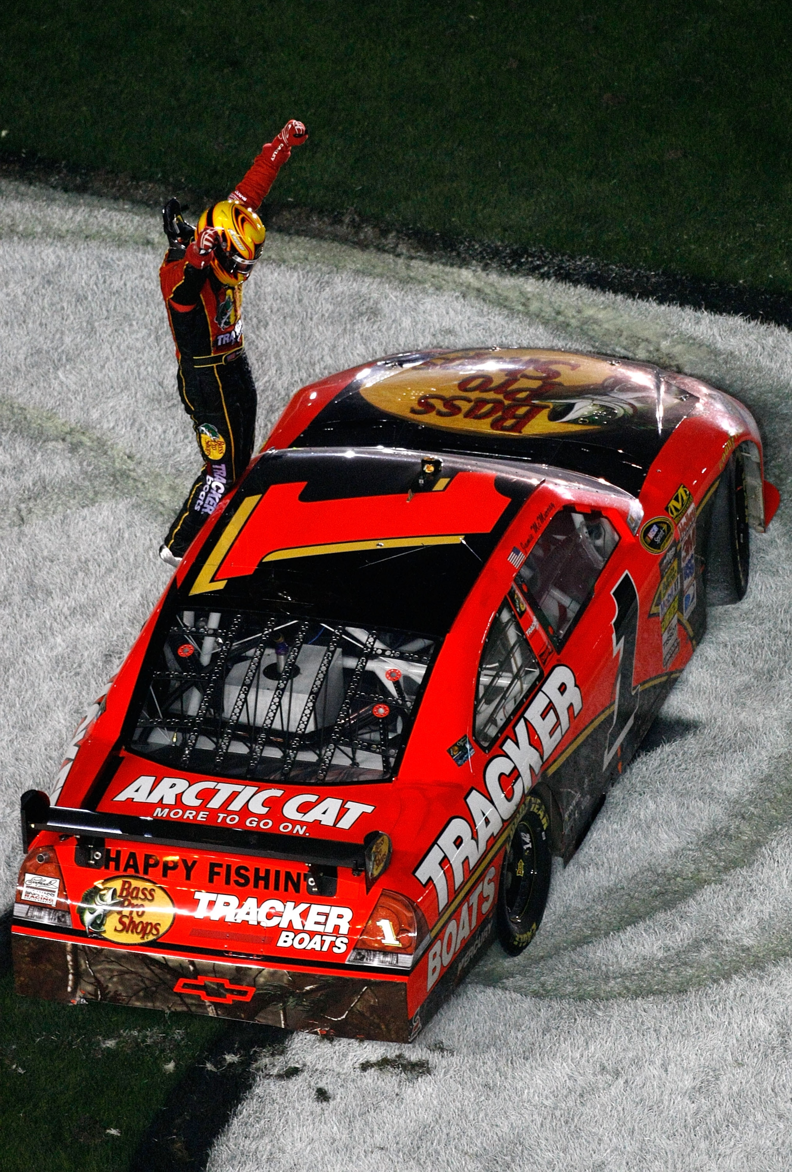 DAYTONA BEACH, FL - FEBRUARY 14:  Jamie McMurray climbs on top of his #1 Bass Tracker Chevrolet to celebrates winning the NASCAR Sprint Cup Series Dayotna 500 at Daytona International Speedway on February 14, 2010 in Daytona Beach, Florida.  (Photo by Jon
