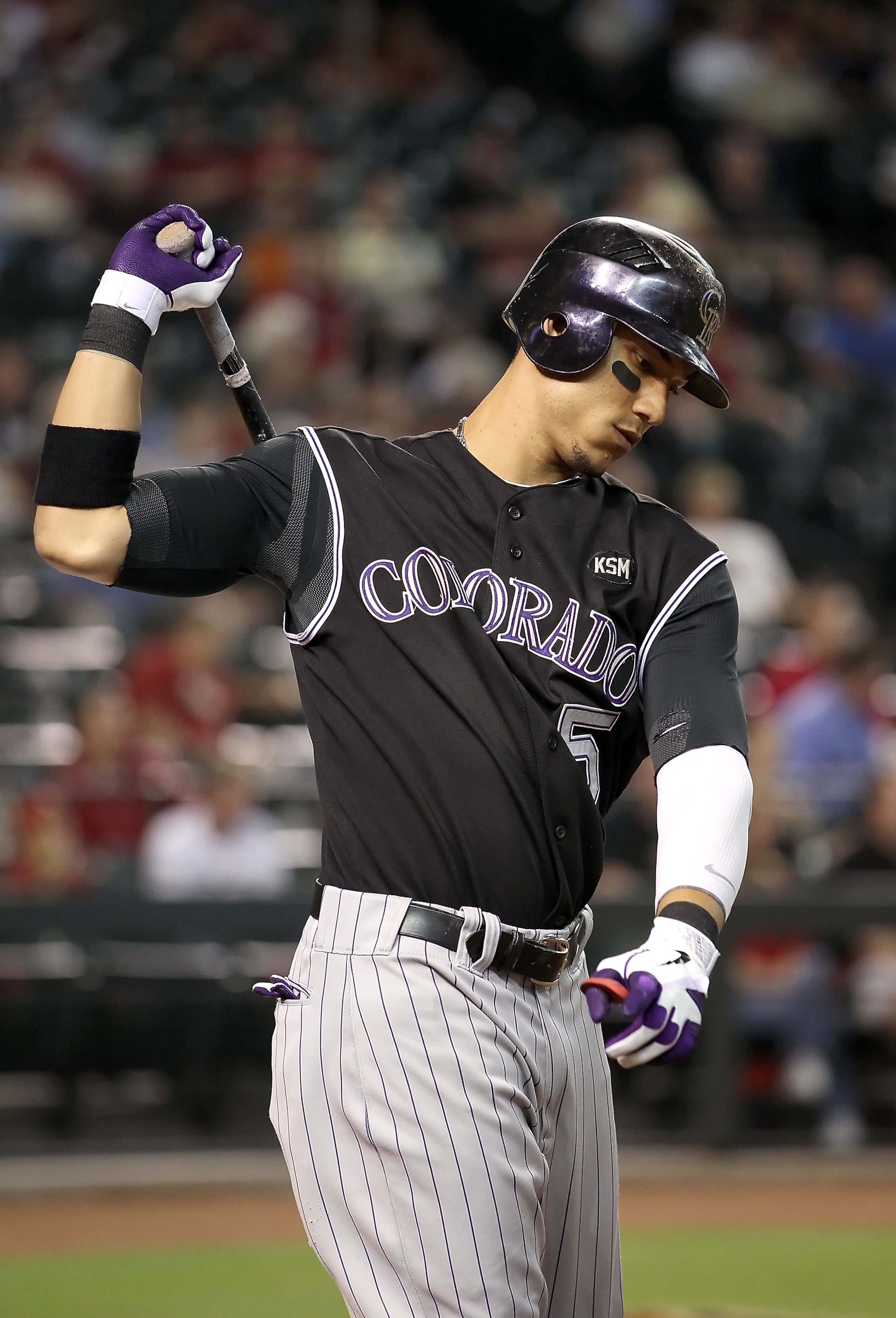 PHOENIX - SEPTEMBER 22: Carlos Gonzalez #5 of the Colorado Rockies warms up on deck during the Major League Baseball game against the Arizona Diamondbacks at Chase Field on September 22, 2010 in Phoenix, Arizona. (Photo by Christian Petersen/Getty Image PHOENIX - SEPTEMBER 22: Carlos Gonzalez #5 of the Colorado Rockies warms up on deck during the Major League Baseball game against the Arizona Diamondbacks at Chase Field on September 22, 2010 in Phoenix, Arizona. (Photo by Christian Petersen/Getty Image