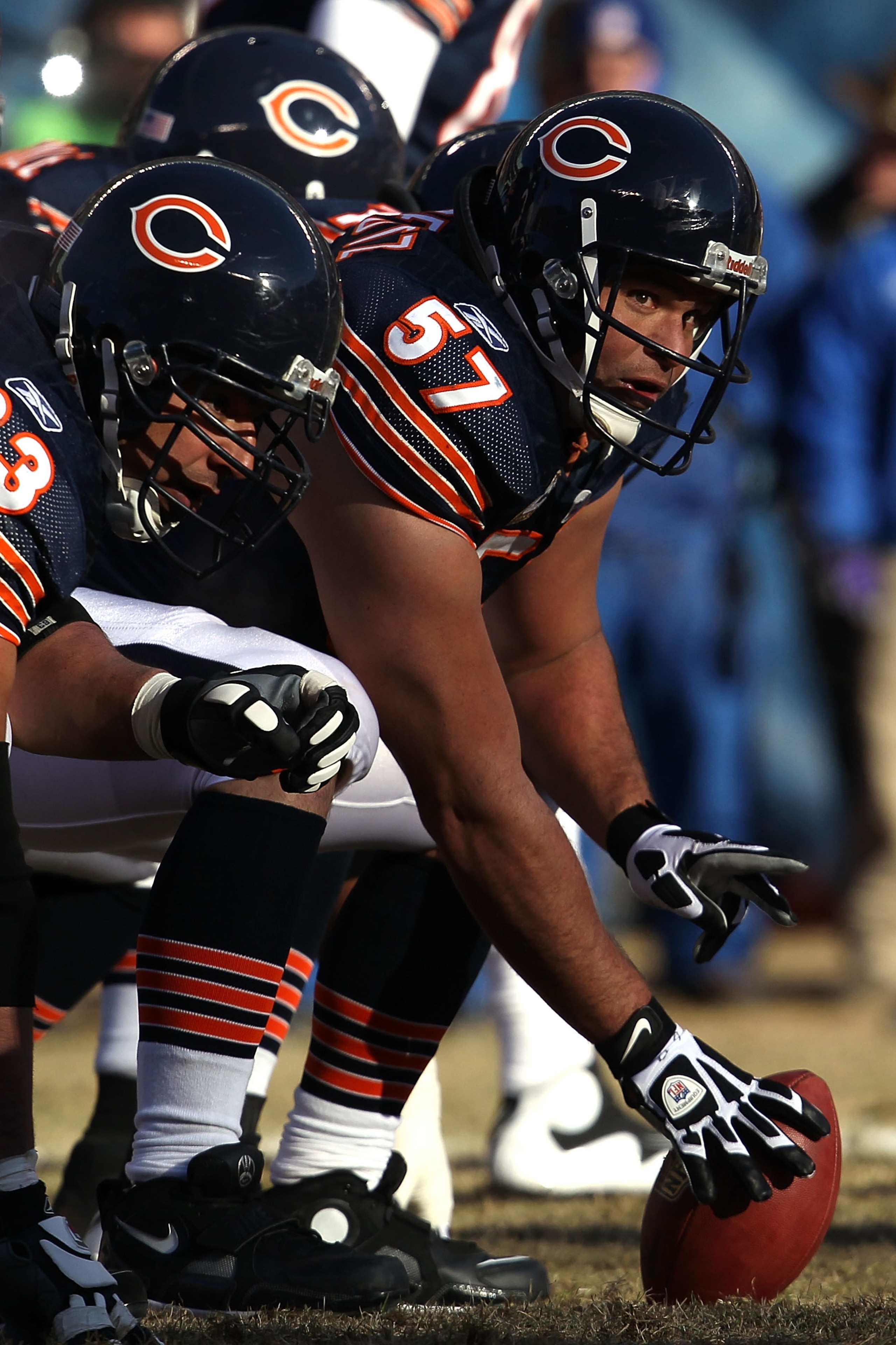 CHICAGO, IL - JANUARY 23:  Center Olin Kreutz #57 of the Chicago Bears prepares to snap the ball against the Green Bay Packers in the NFC Championship Game at Soldier Field on January 23, 2011 in Chicago, Illinois.  (Photo by Jonathan Daniel/Getty Images)