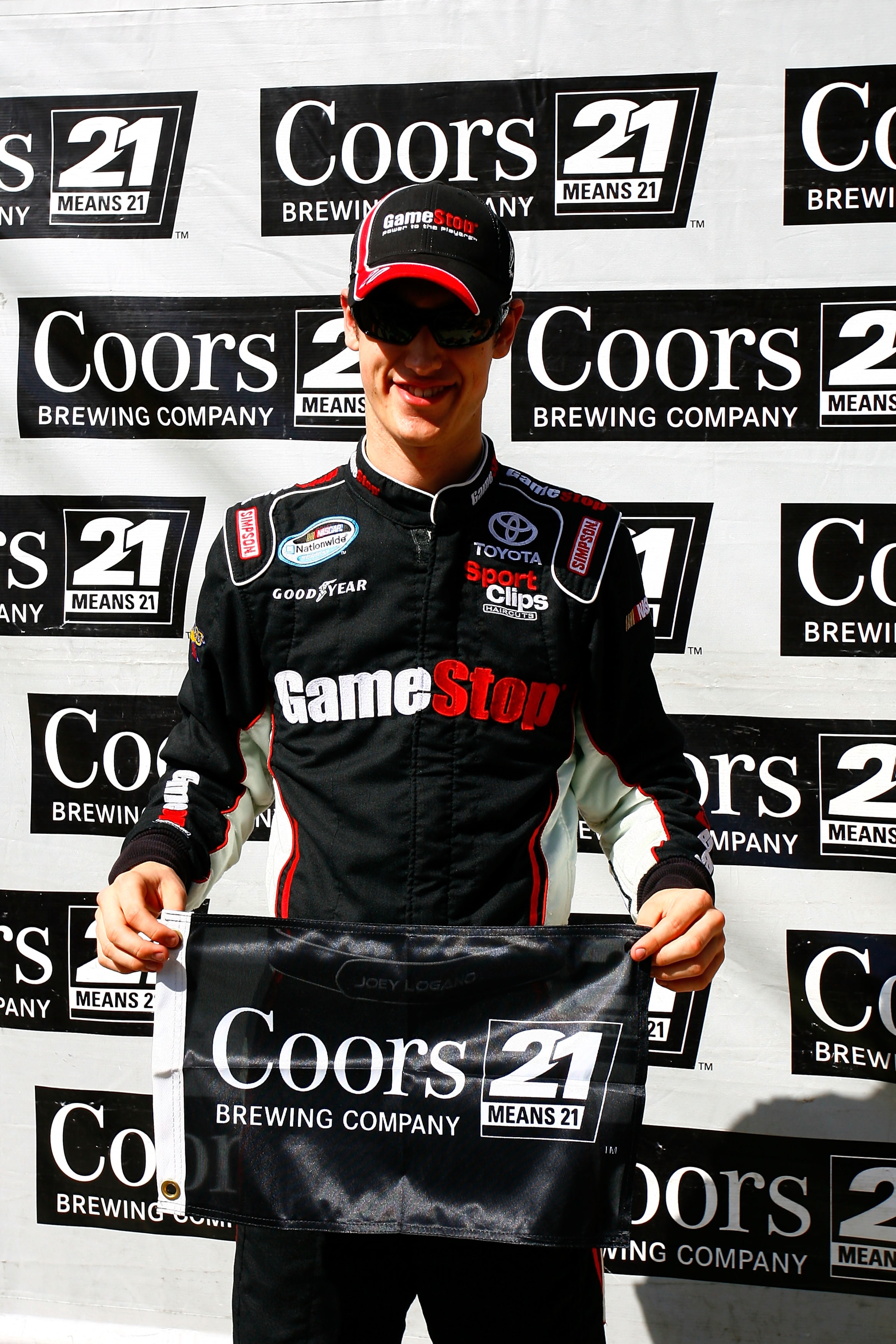 HOMESTEAD, FL - NOVEMBER 20:  Joey Logano, driver of the #20 GameStop/MASTIFF Toyota, celebrates setting the pole position during qualifying for the NASCAR Nationwide Series Ford 300 at Homestead-Miami Speedway on November 20, 2010 in Homestead, Florida.