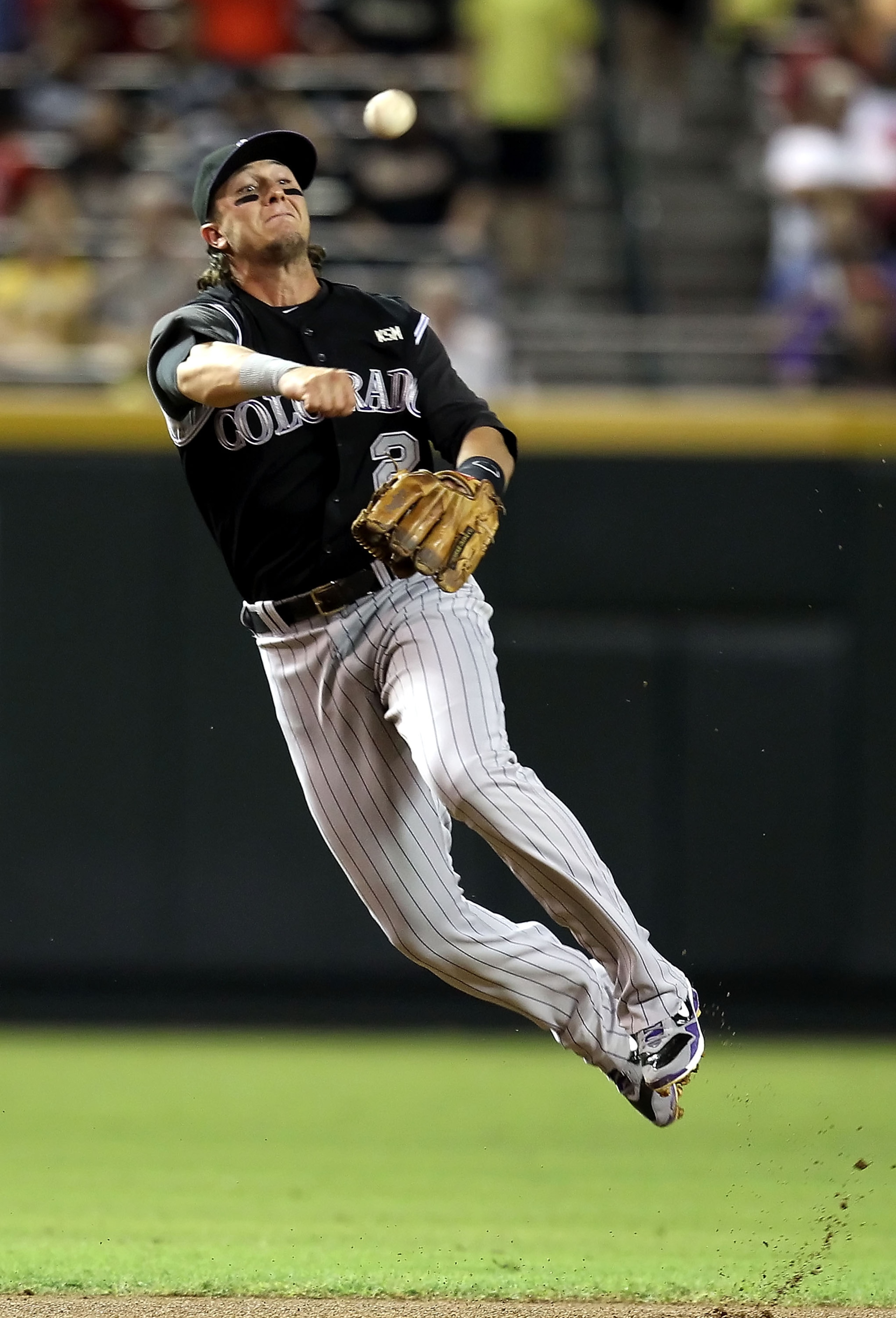 PHOENIX - SEPTEMBER 21:  Infielder Troy Tulowitzki #2 of the Colorado Rockies fields a ground ball out against the Arizona Diamondbacks during the first inning of the Major League Baseball game at Chase Field on September 21, 2010 in Phoenix, Arizona.  (P