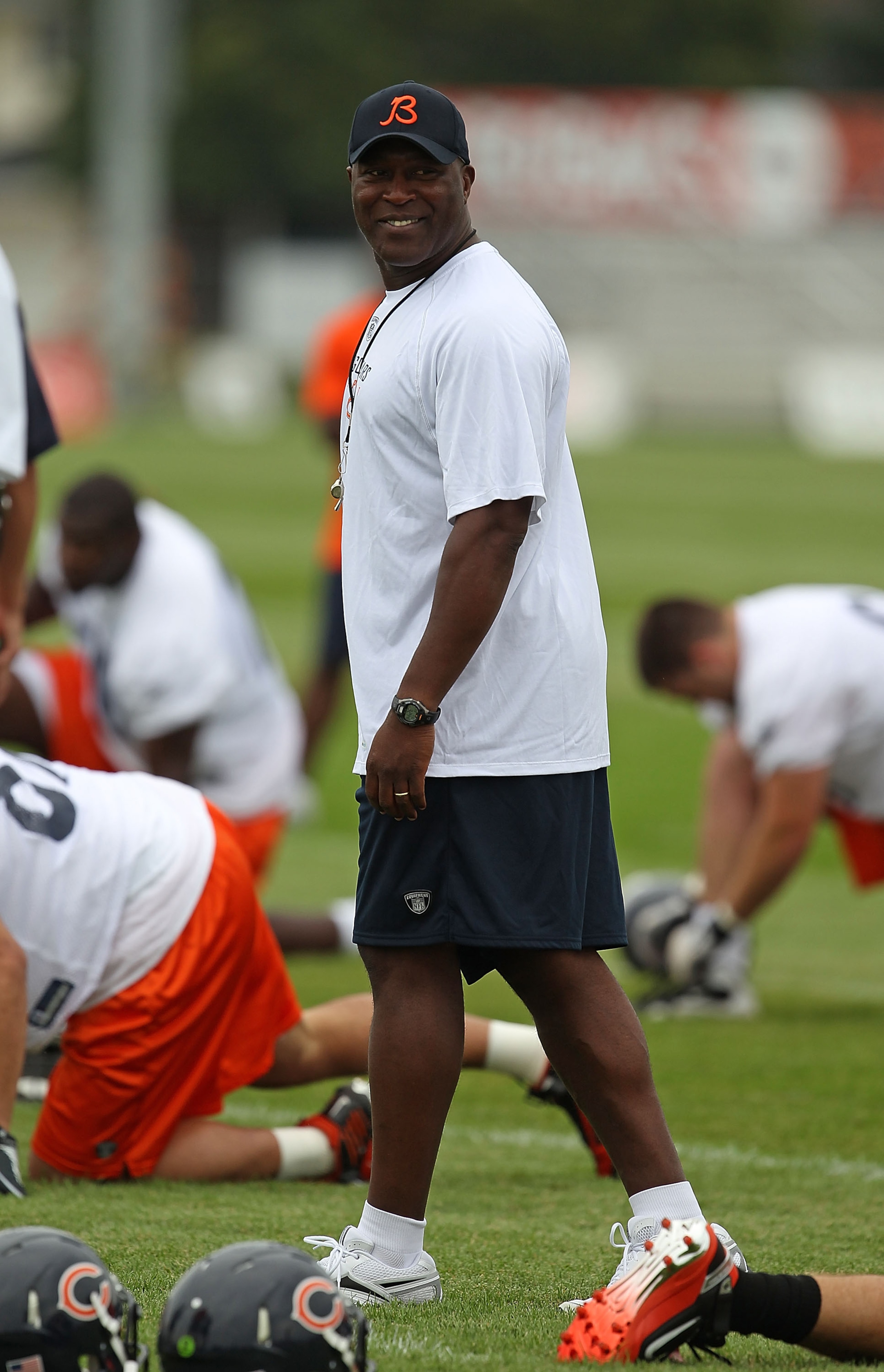 BOURBONNAIS, IL - JULY 30: Head coach Lovie Smith of the Chicago Bears watches as his team stretches prior to a summer training camp practice at Olivet Nazarene University on July 30, 2010 in Bourbonnais, Illinois. (Photo by Jonathan Daniel/Getty Images)