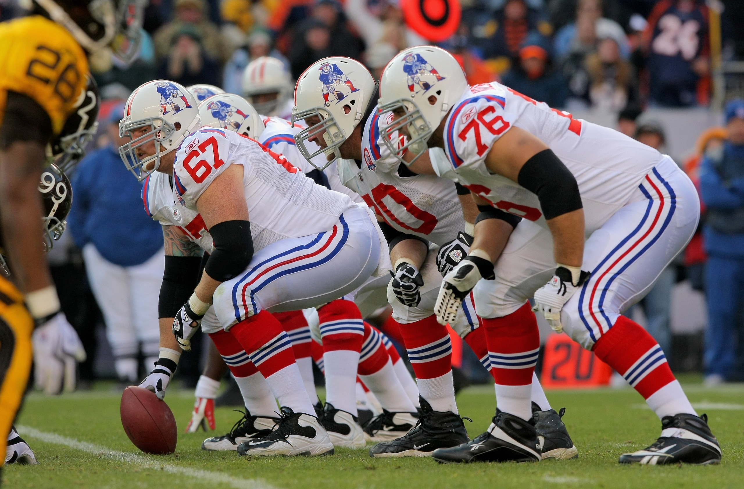 DENVER - OCTOBER 11:  Center Dan Koppen #67 of the New England Patriots prepares to snap the ball as the offensive line readies for pass protection against the Denver Broncos during NFL action at Invesco Field at Mile High on October 11, 2009 in Denver, C