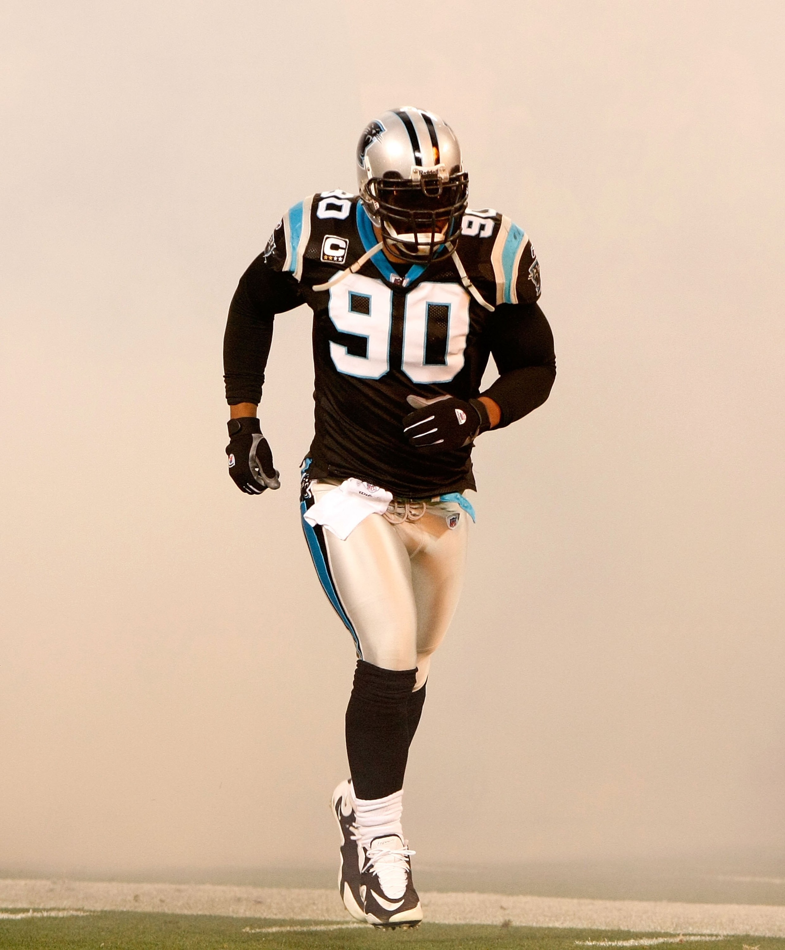 CHARLOTTE, NC - DECEMBER 20: Julius Peppers #90 of the Carolina Panthers against the Minnesota Vikings at Bank of America Stadium on December 20, 2009 in Charlotte, North Carolina. (Photo by Kevin C. Cox/Getty Images) CHARLOTTE, NC - DECEMBER 20: Julius Peppers #90 of the Carolina Panthers against the Minnesota Vikings at Bank of America Stadium on December 20, 2009 in Charlotte, North Carolina. (Photo by Kevin C. Cox/Getty Images)