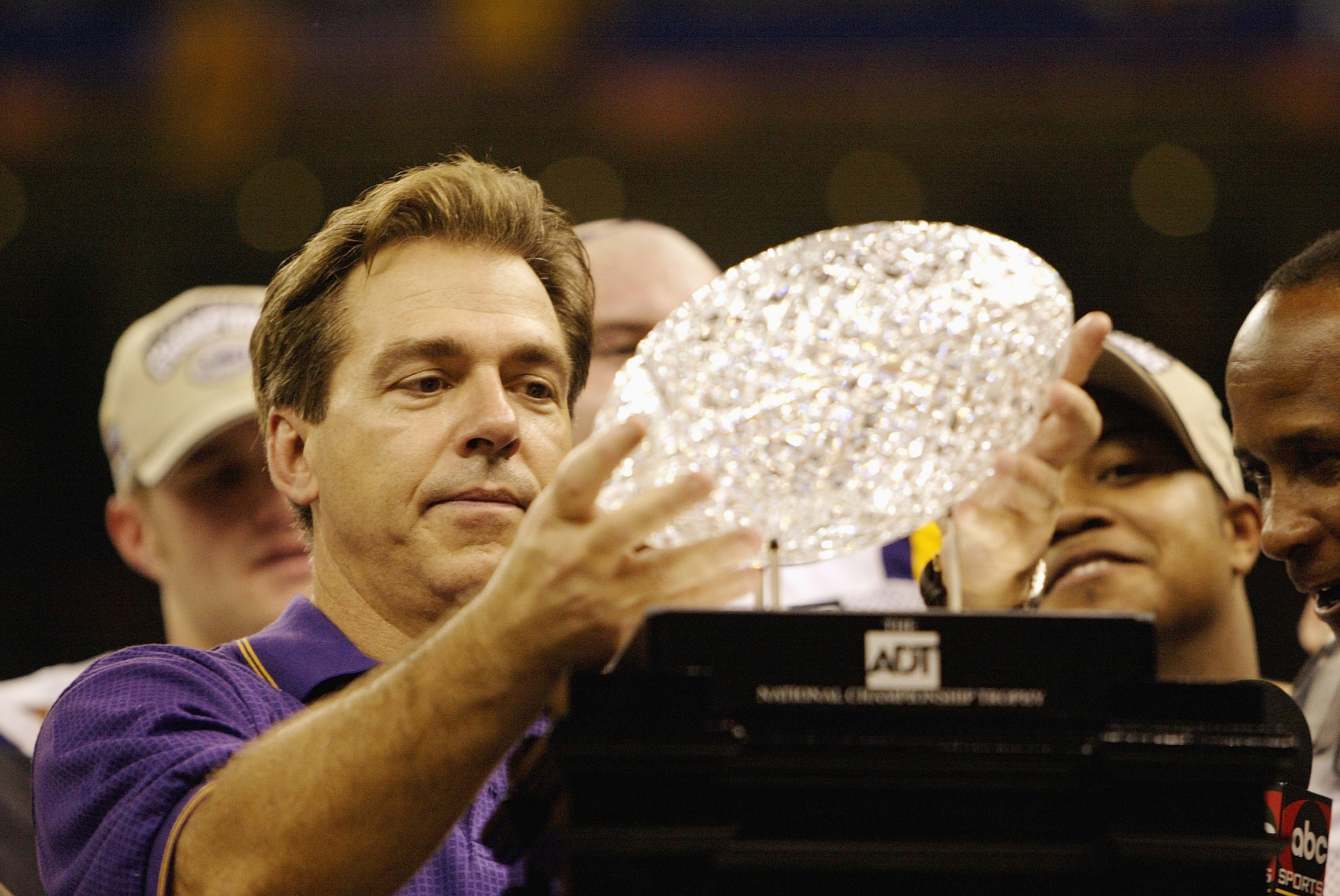 NEW ORLEANS - JANUARY 4:  Head coach Nick Saban of the Loiusiana State Tigers holds up the Bowl Championship Series Trophy after his team defeated the Oklahoma Sooners in the Nokia Sugar Bowl National Championship on January 4, 2004 at the Louisiana Super